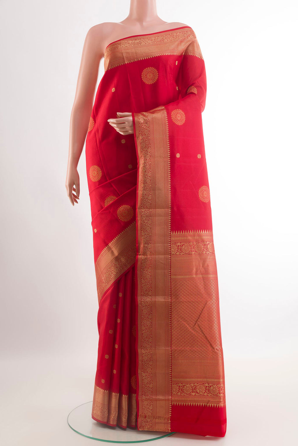 Red Kanchipuram Silk Saree with Zari Butta on the body and Zari Border.  displayed on a mannequin