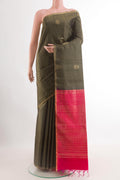 Grey Raw Silk Saree with Zari Butta on the body and Zari Border.  displayed on a mannequin