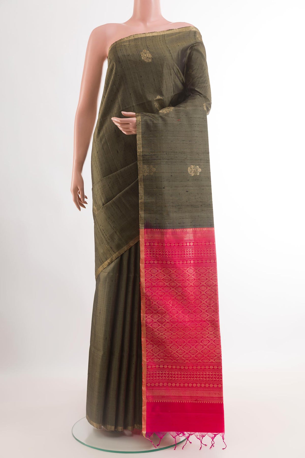 Grey Raw Silk Saree with Zari Butta on the body and Zari Border.  displayed on a mannequin