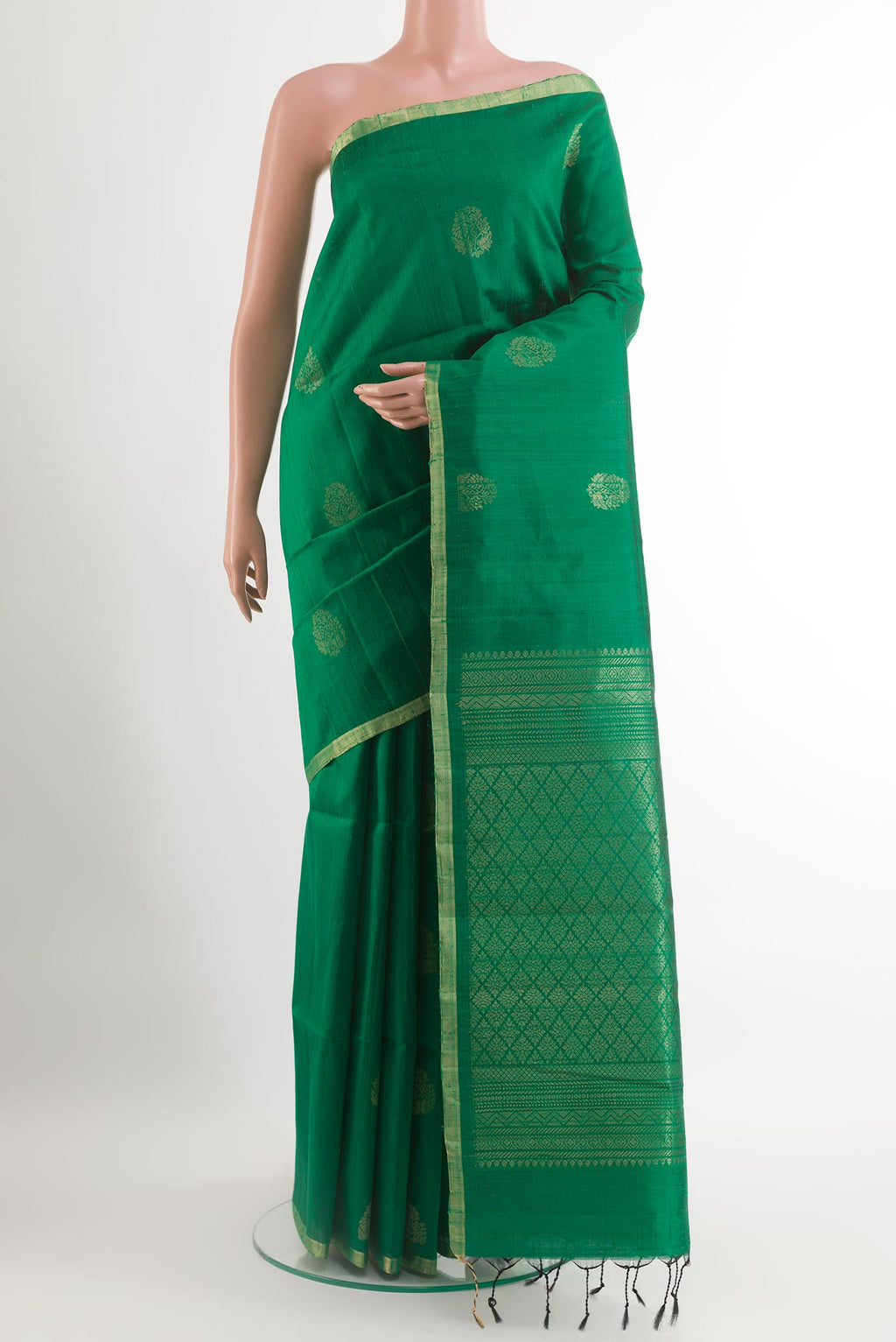 Green Raw Silk Saree with Zari Butta on the body and Zari Border.  displayed on a mannequin