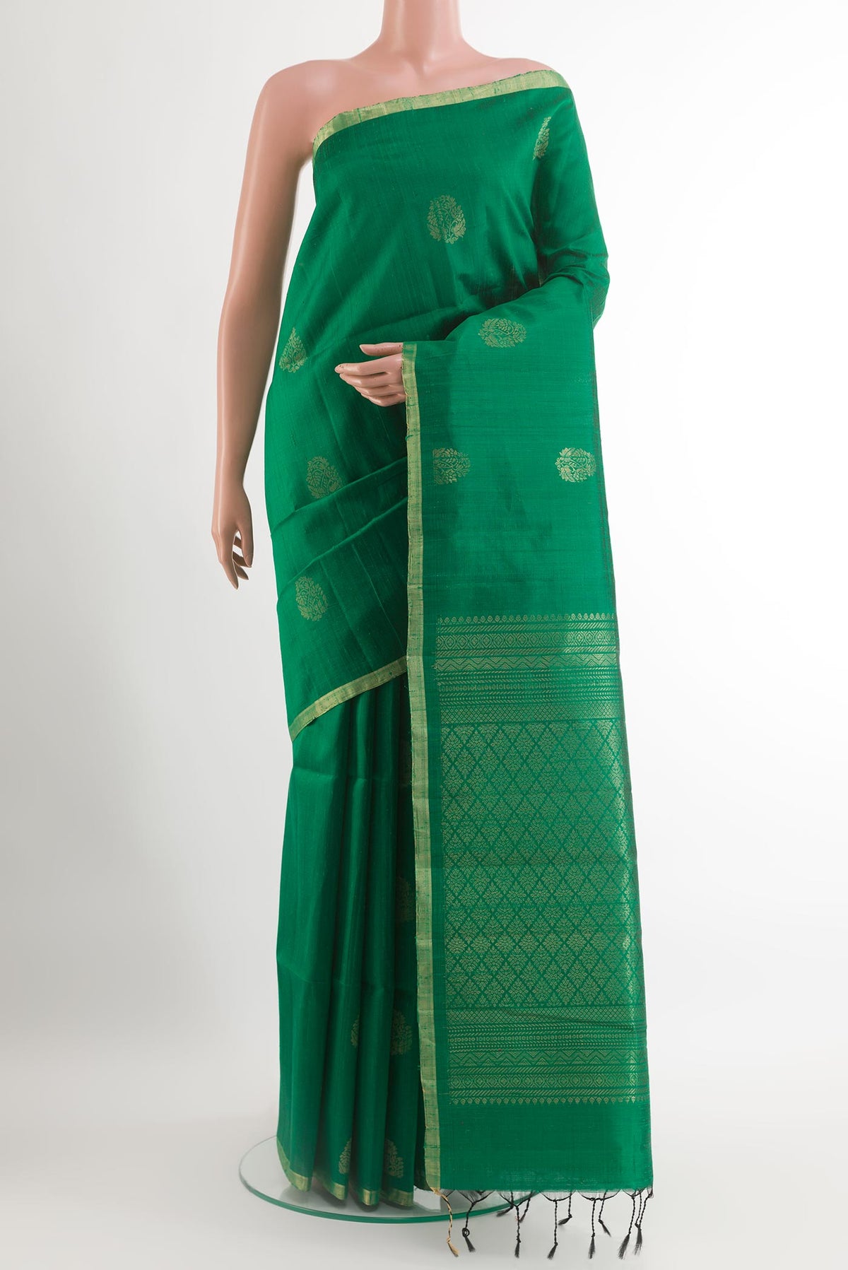 Green Raw Silk Saree with Zari Butta on the body and Zari Border.  displayed on a mannequin
