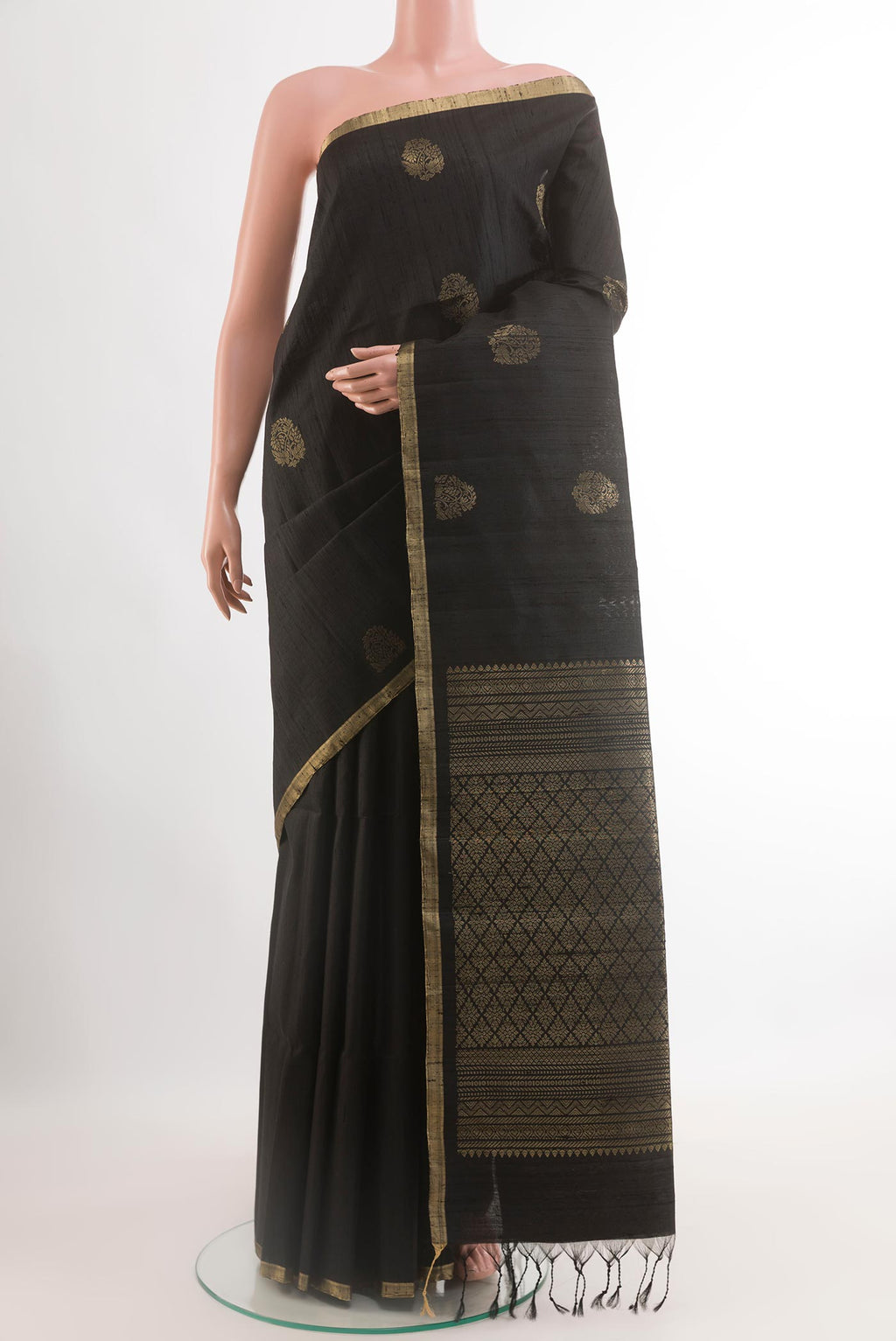 Black Raw Silk Saree with Zari Butta on the body and Zari Border.  displayed on a mannequin