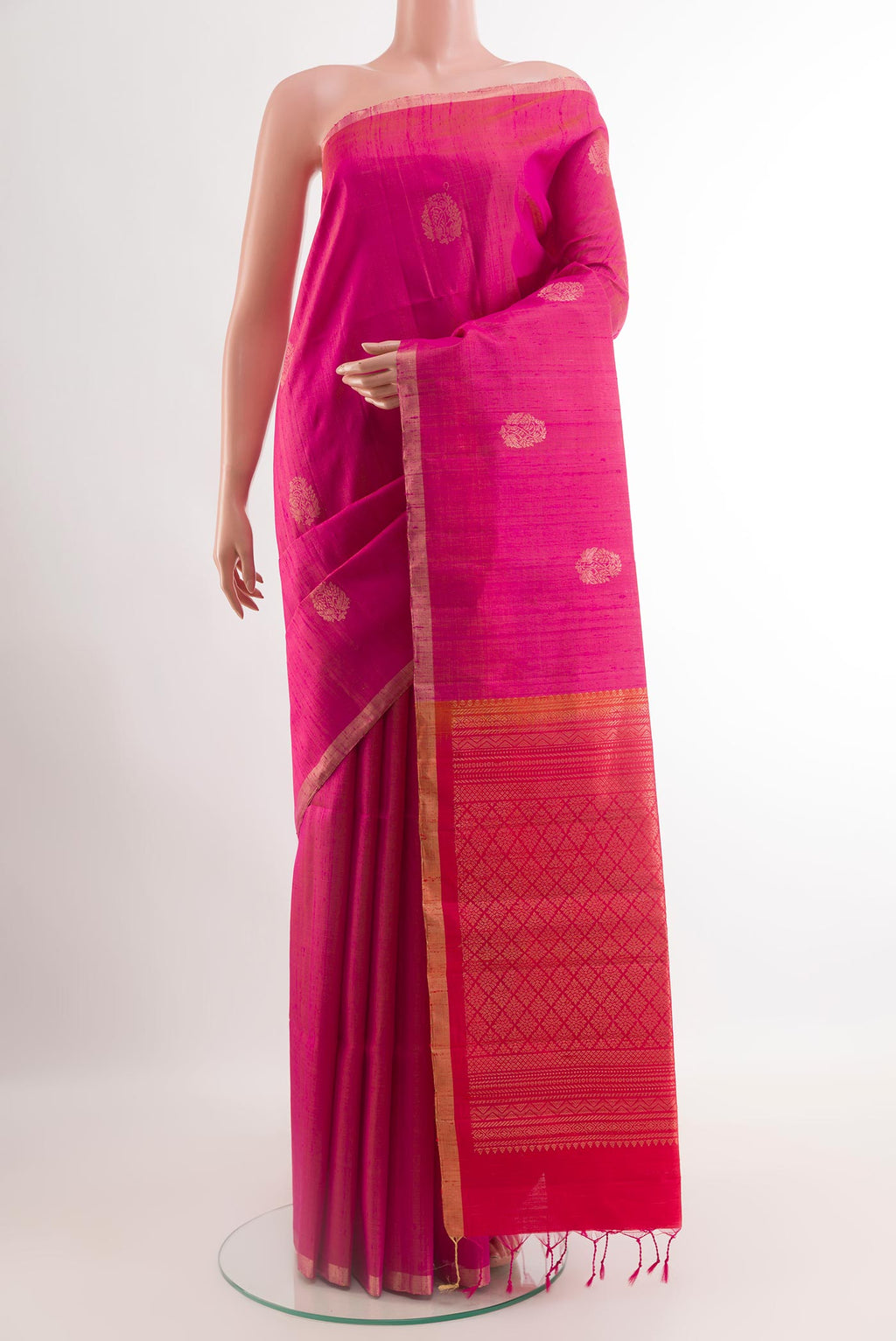 Pink Raw Silk Saree with Zari Butta on the body and Zari Border.  displayed on a mannequin