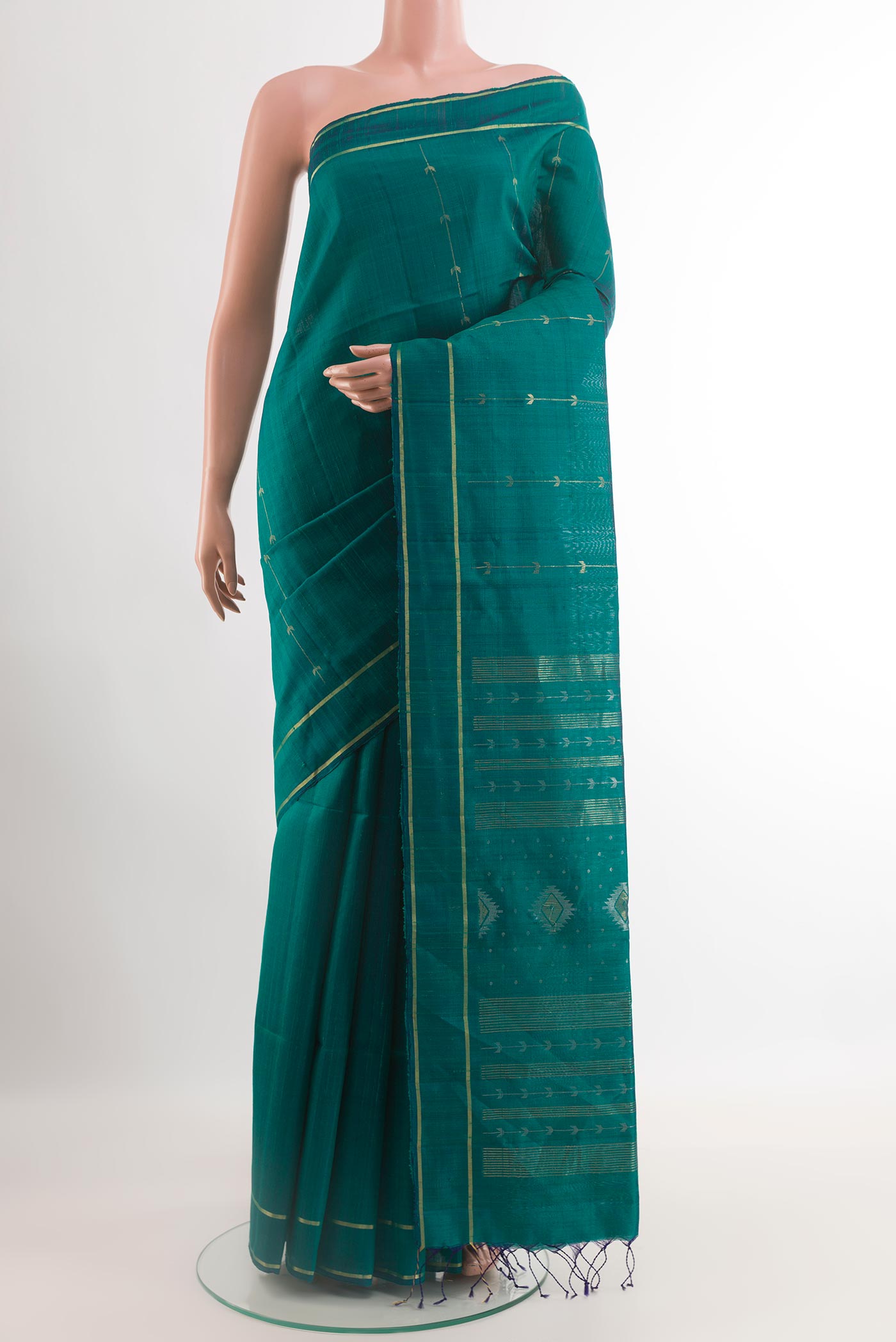 Teal Raw Silk Saree with Zari Butta on the body and Zari Border.  displayed on a mannequin