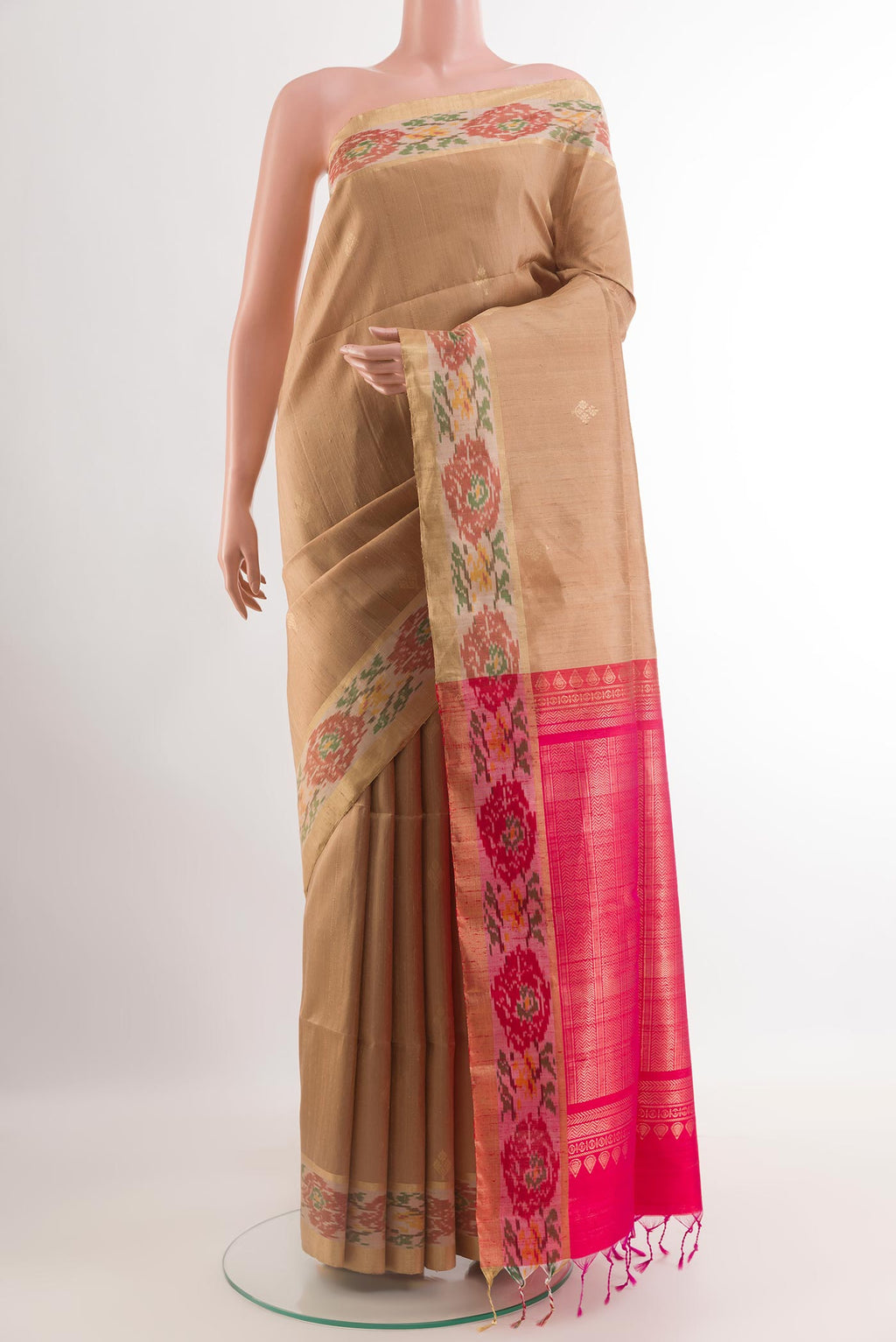 Beige Raw Silk Saree with Zari Butta on the body and Zari Border.  displayed on a mannequin