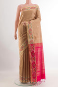 Beige Raw Silk Saree with Zari Butta on the body and Zari Border.  displayed on a mannequin
