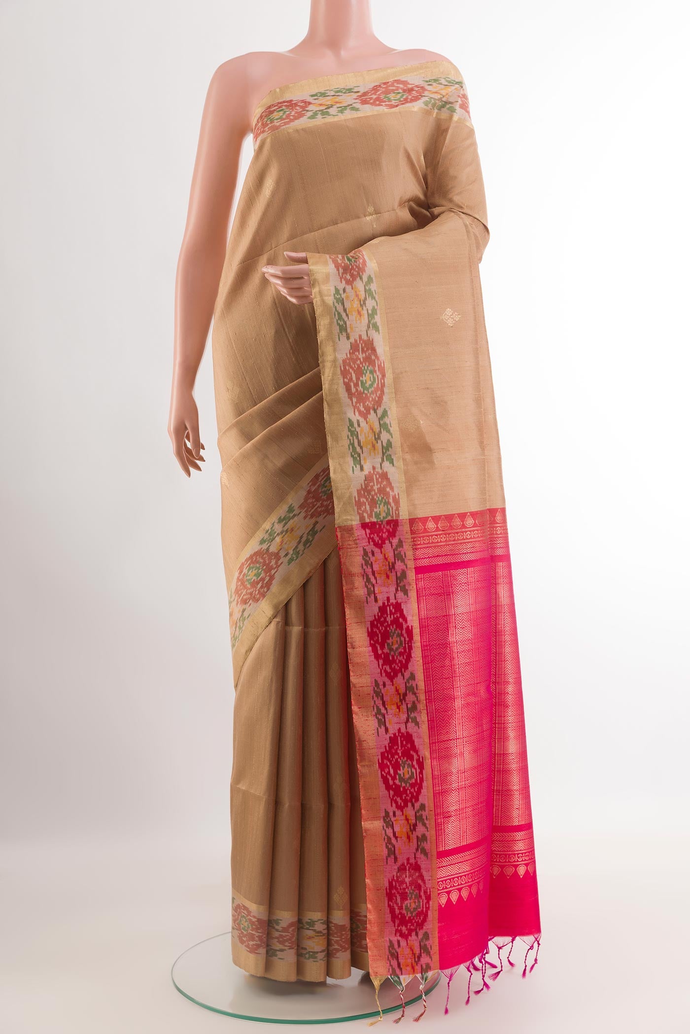 Beige Raw Silk Saree with Zari Butta on the body and Zari Border.  displayed on a mannequin