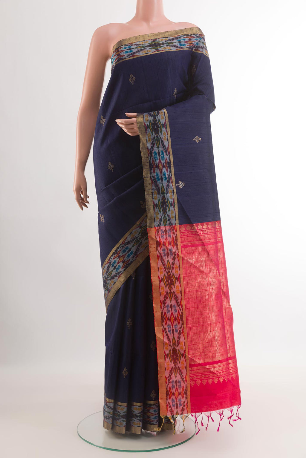 Blue Raw Silk Saree with Zari Butta on the body and Zari Border.  displayed on a mannequin