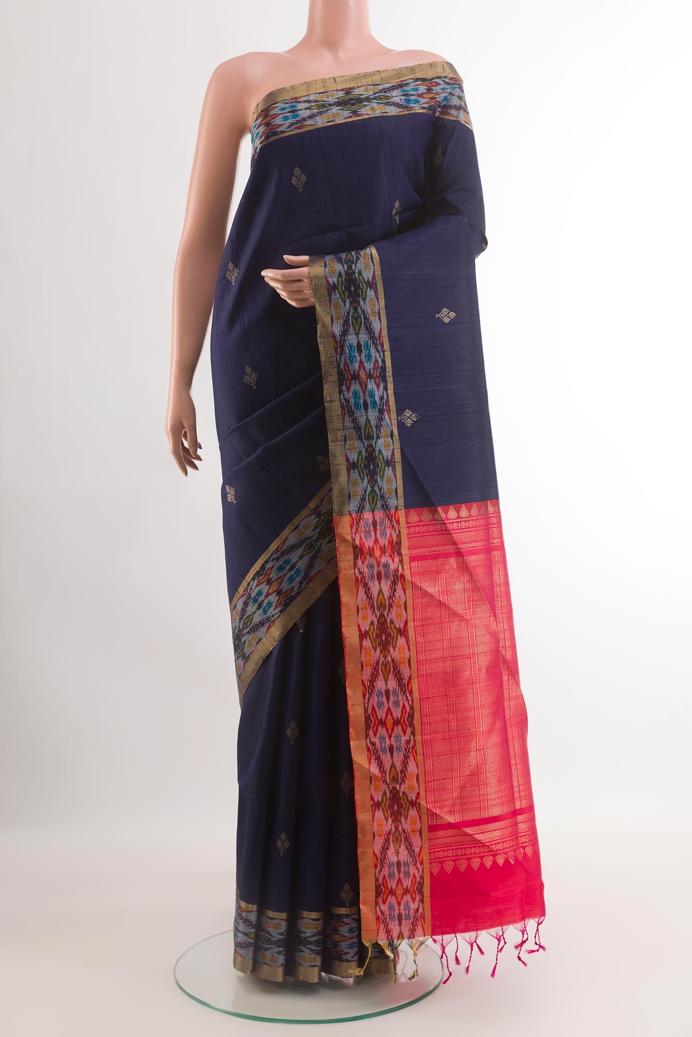 Blue Raw Silk Saree with Zari Butta on the body and Zari Border.  displayed on a mannequin