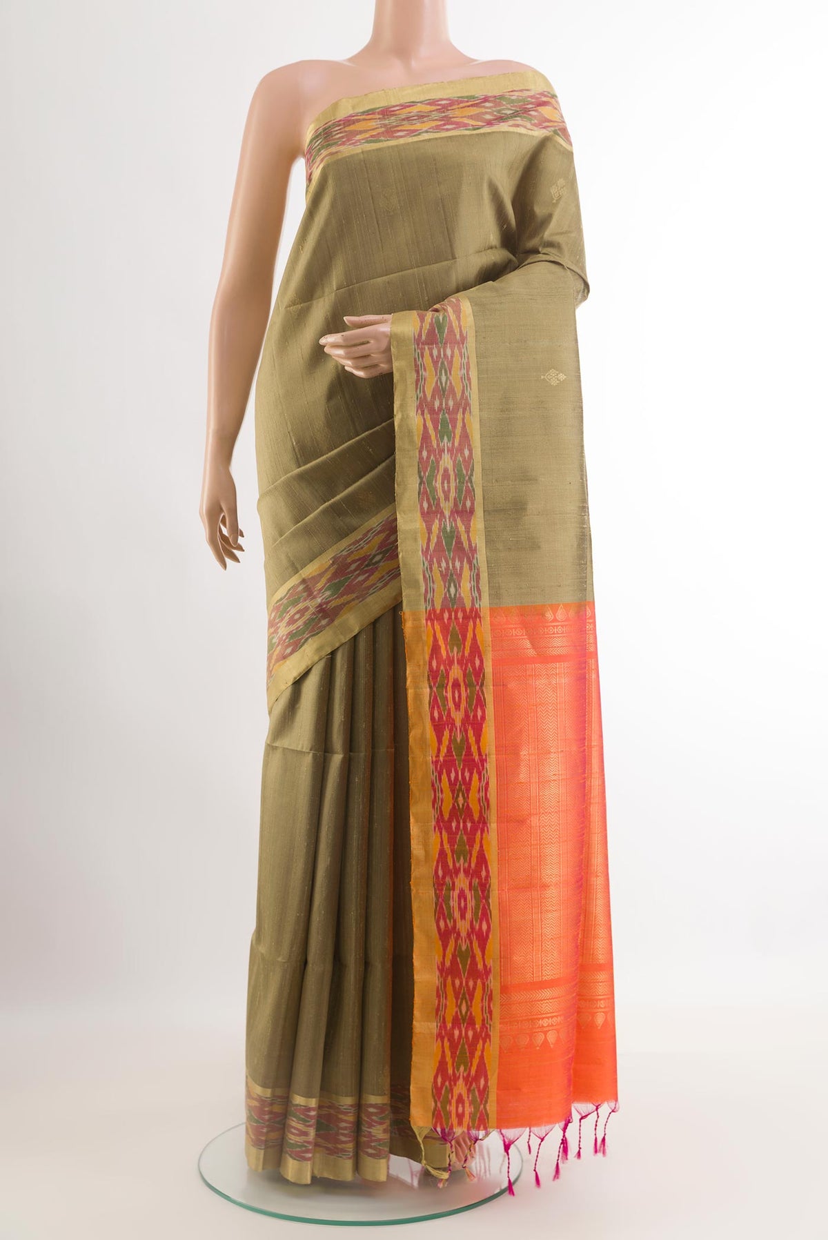 Beige Raw Silk Saree with Zari Butta on the body and Zari Border.  displayed on a mannequin