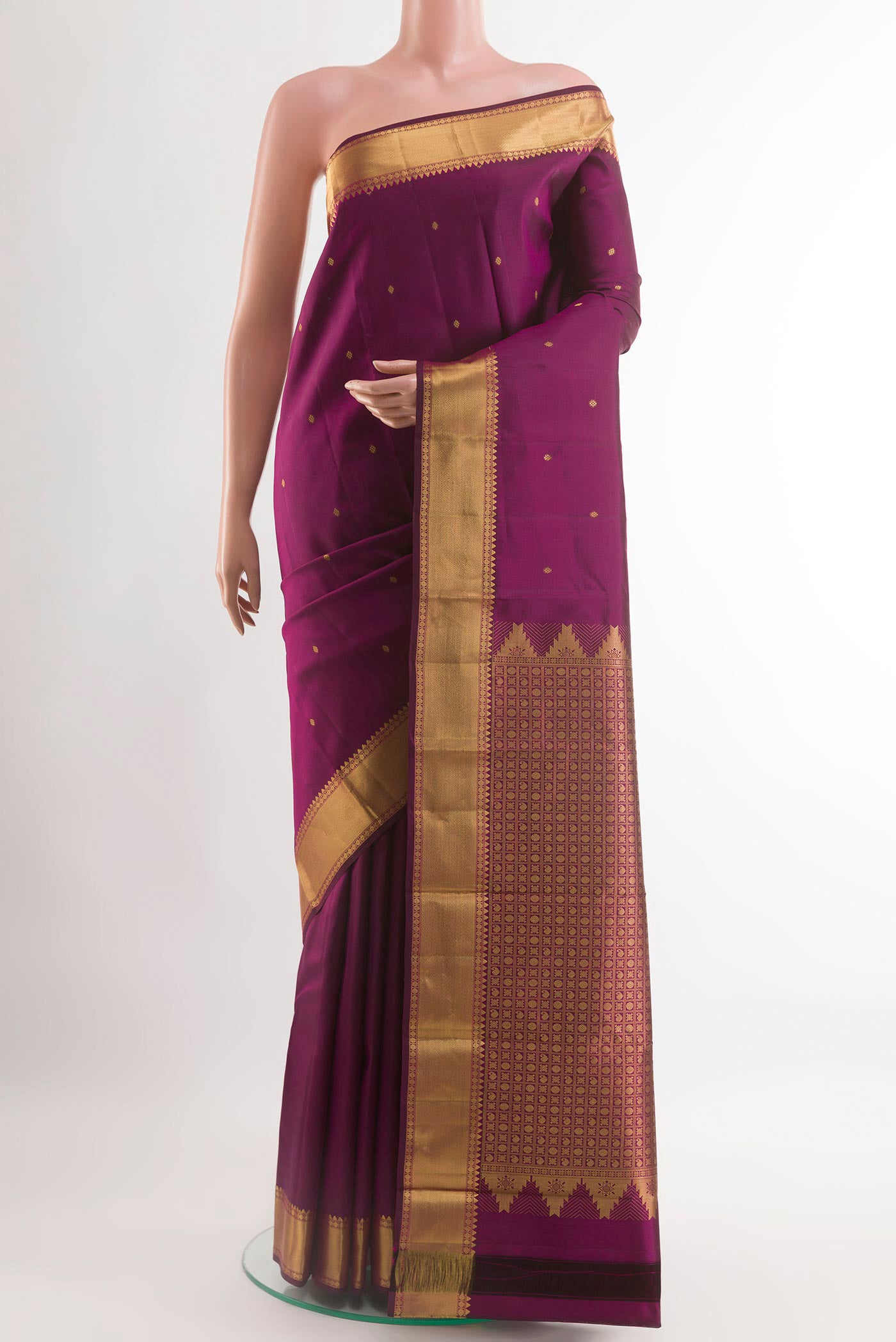 Purple Kanjivaram Silk Saree with Zari Butta on the body and Zari Border.  displayed on a mannequin