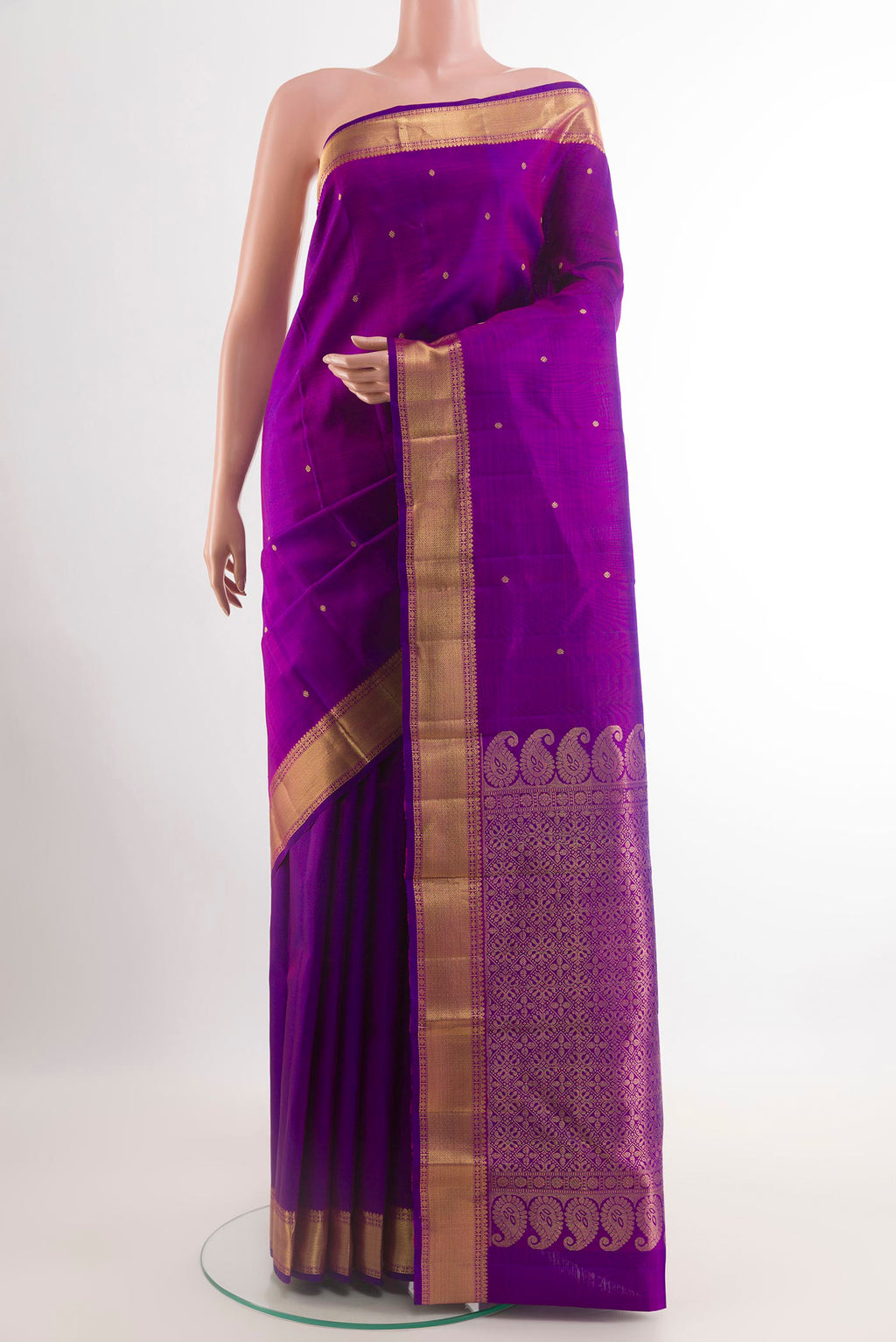 Purple Kanjivaram Silk Saree with Zari Butta on the body and Zari Border.  displayed on a mannequin
