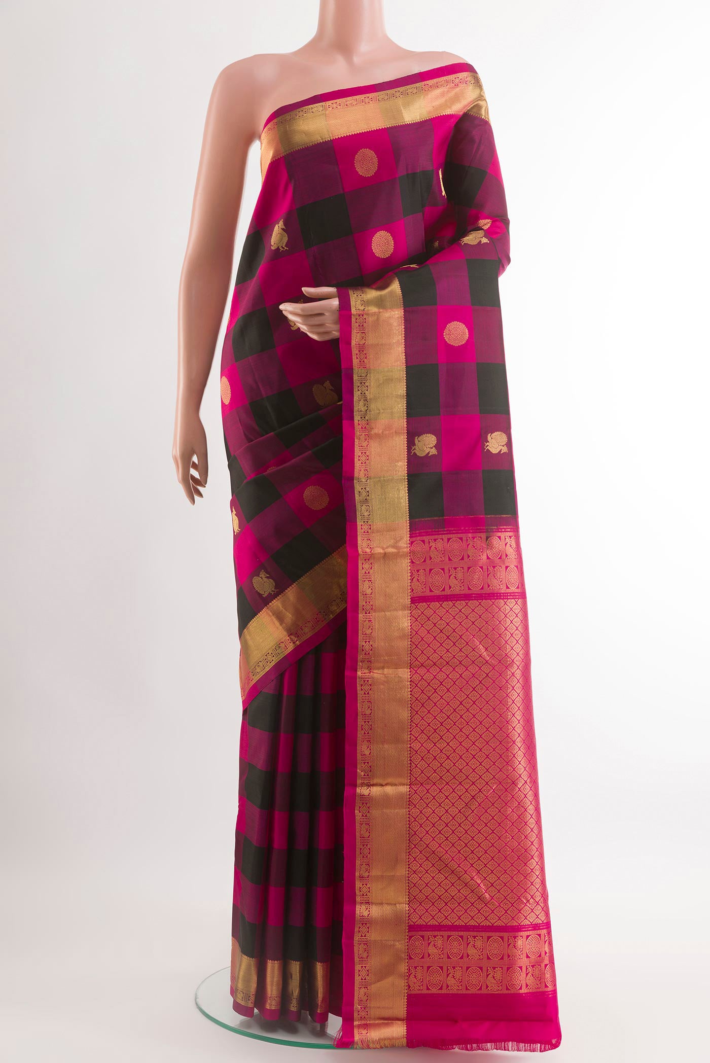 Multi Color Kanchipuram Silk Saree with Checked design on the body and Zari Border.  displayed on a mannequin