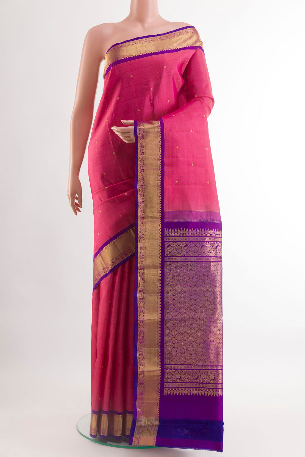 Pink Kanchipuram Silk Saree with Zari Butta on the body and Zari Border.  displayed on a mannequin