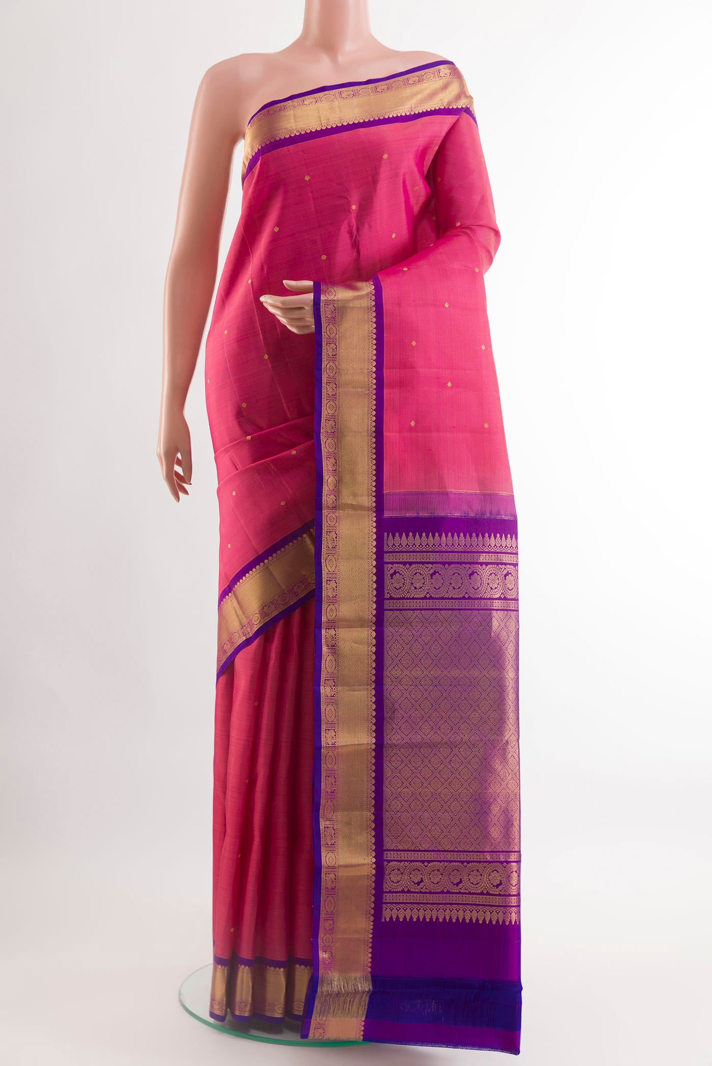 Pink Kanchipuram Silk Saree with Zari Butta on the body and Zari Border.  displayed on a mannequin