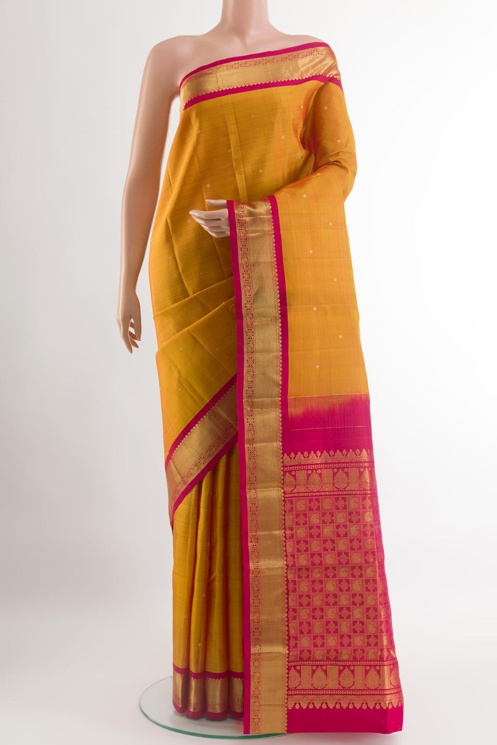 Orange Kanchipuram Silk Saree with Zari Butta on the body and Zari Border.  displayed on a mannequin