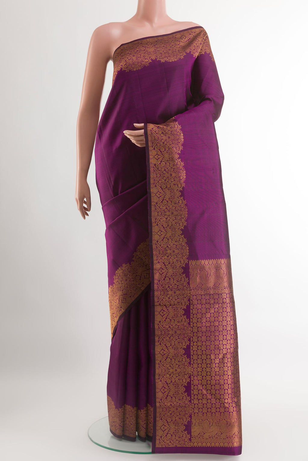 Purple Kanchipuram Silk Saree with Plain Body and Zari Border.  displayed on a mannequin