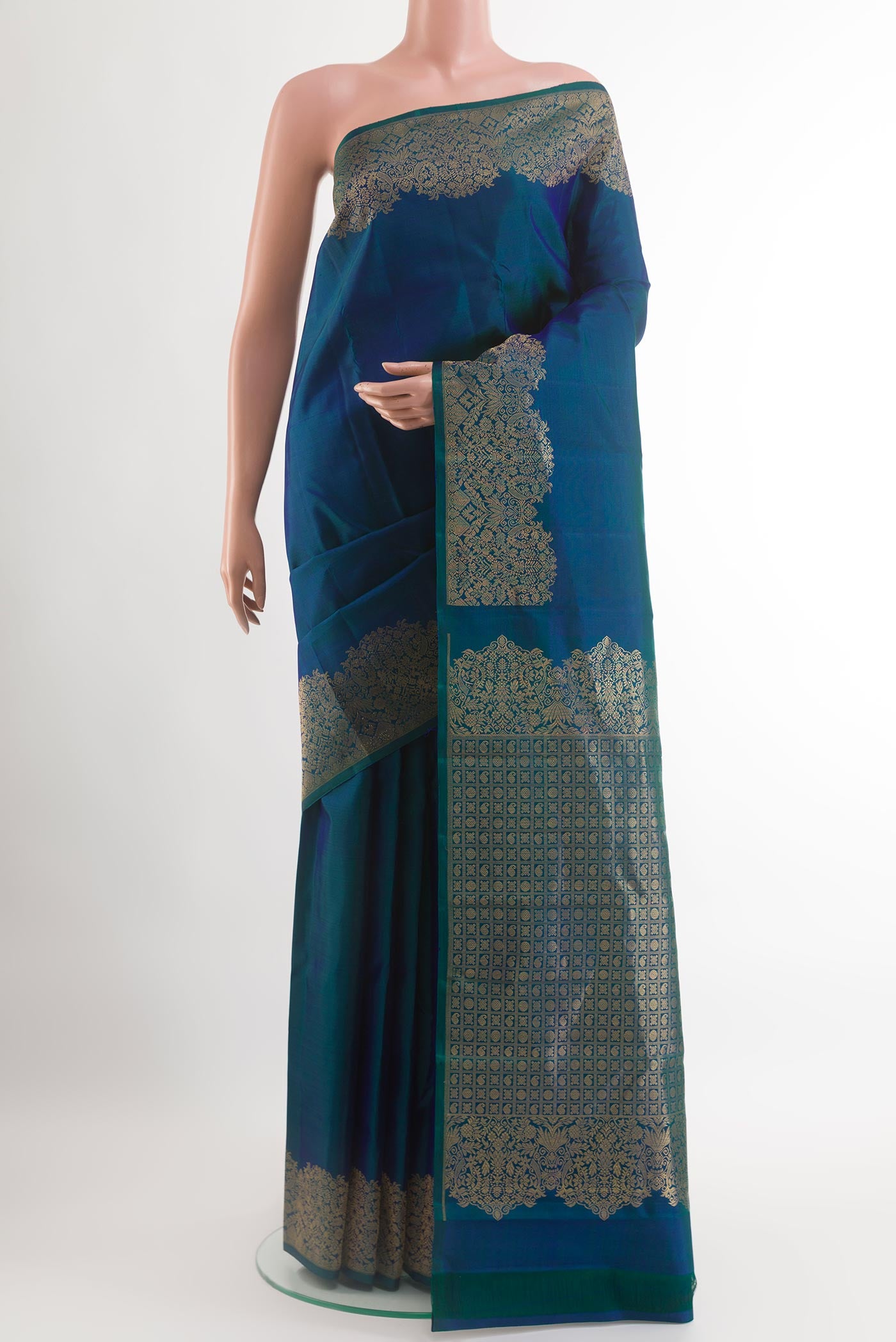 Peacock Blue Kanchipuram Silk Saree with Plain Body and Zari Border.  displayed on a mannequin
