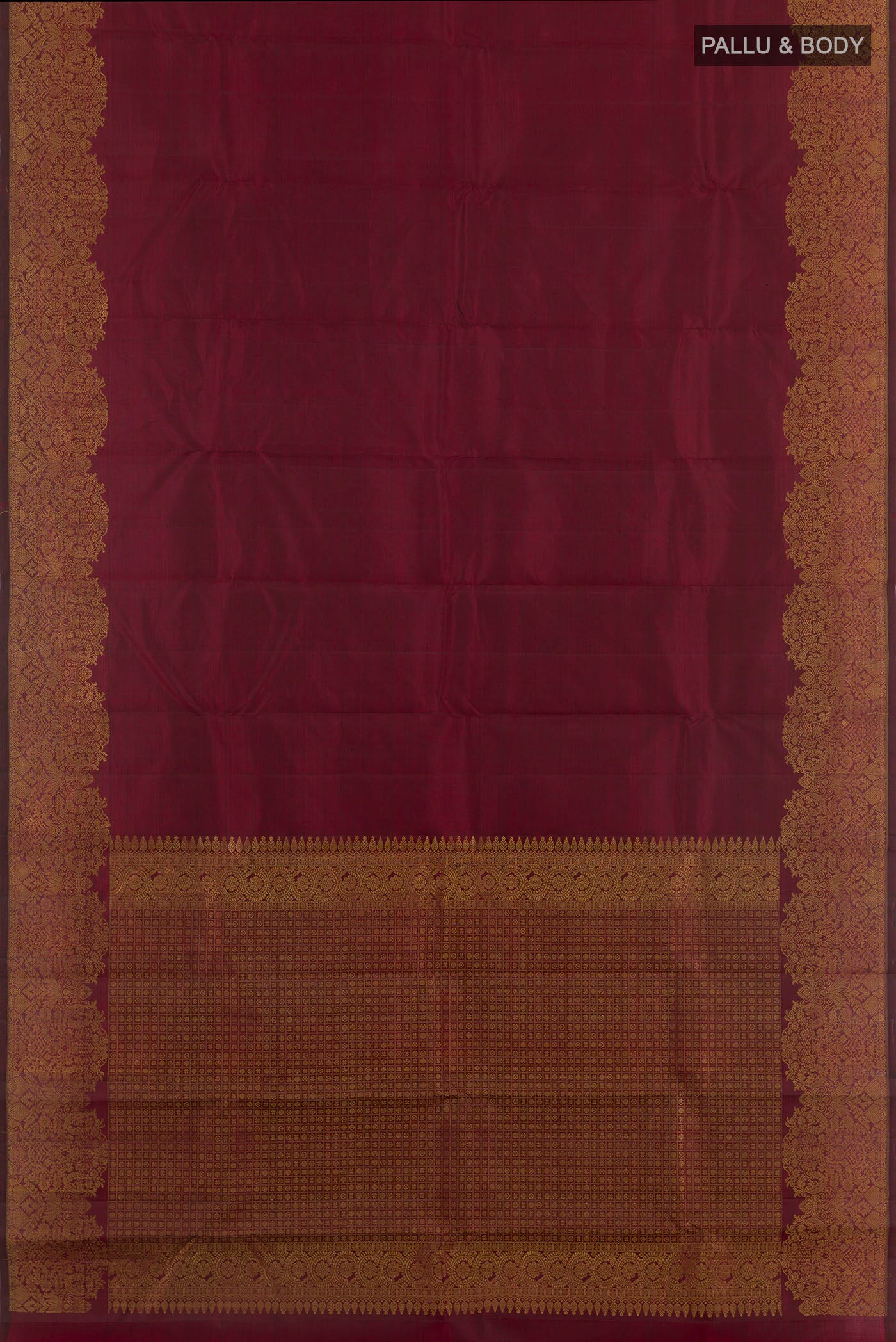 Flat view of Maroon Kanchipuram Silk Saree with Zari Butta on the body and Zari Border. 