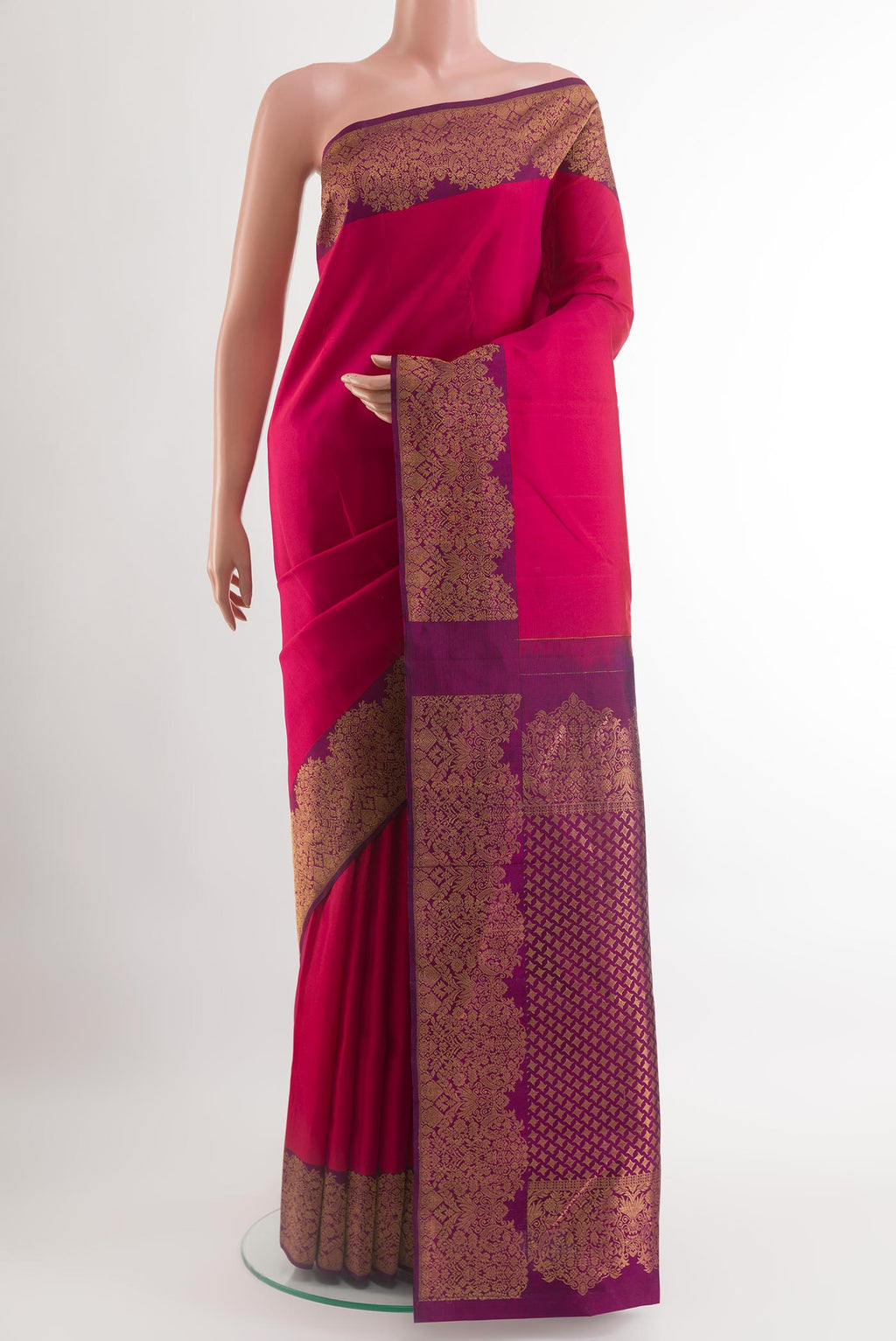 Pink Kanchipuram Silk Saree with Plain Body and Zari Border.  displayed on a mannequin