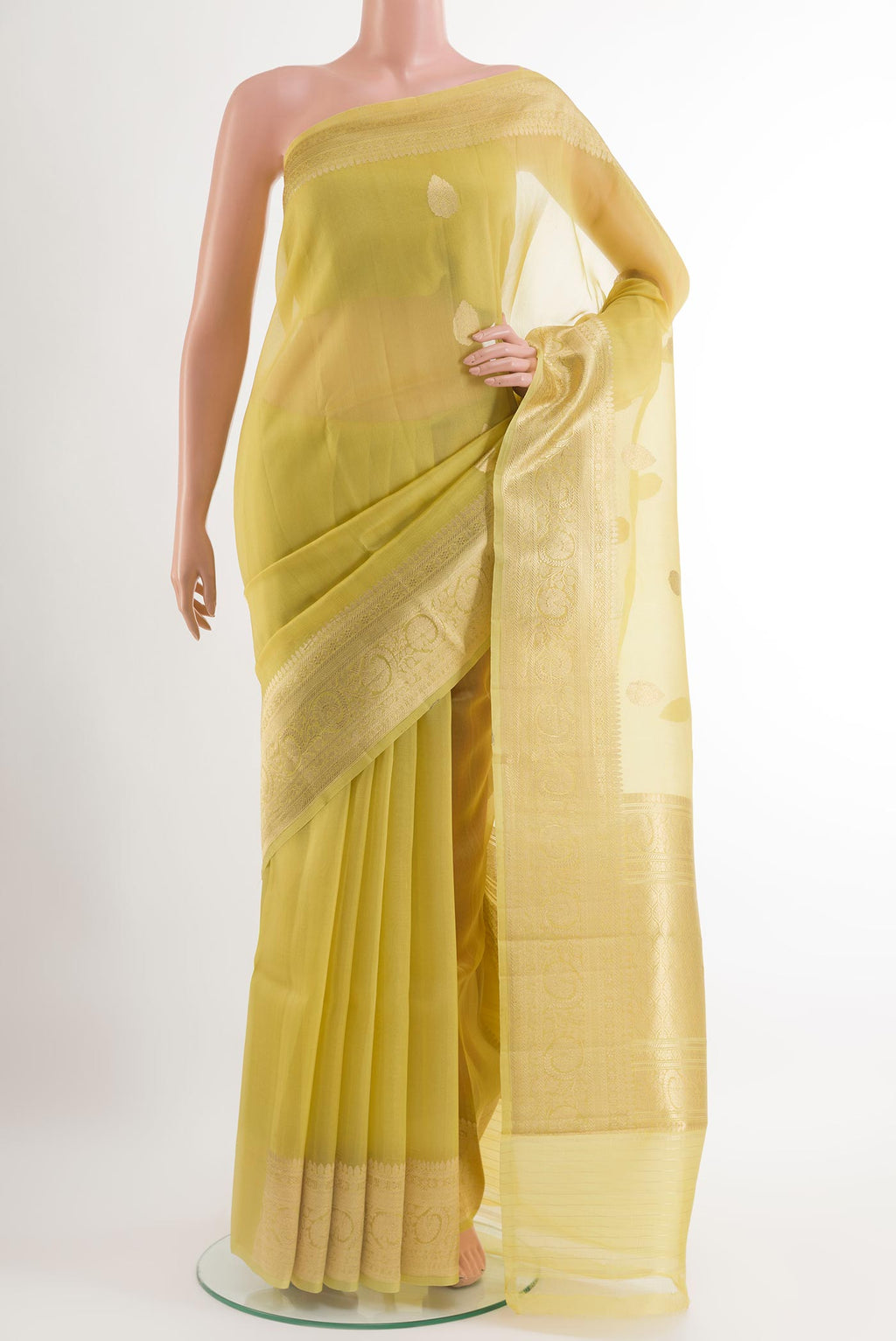 Yellow Organza Silk Saree with Zari Butta on the body and Zari Border.  displayed on a mannequin