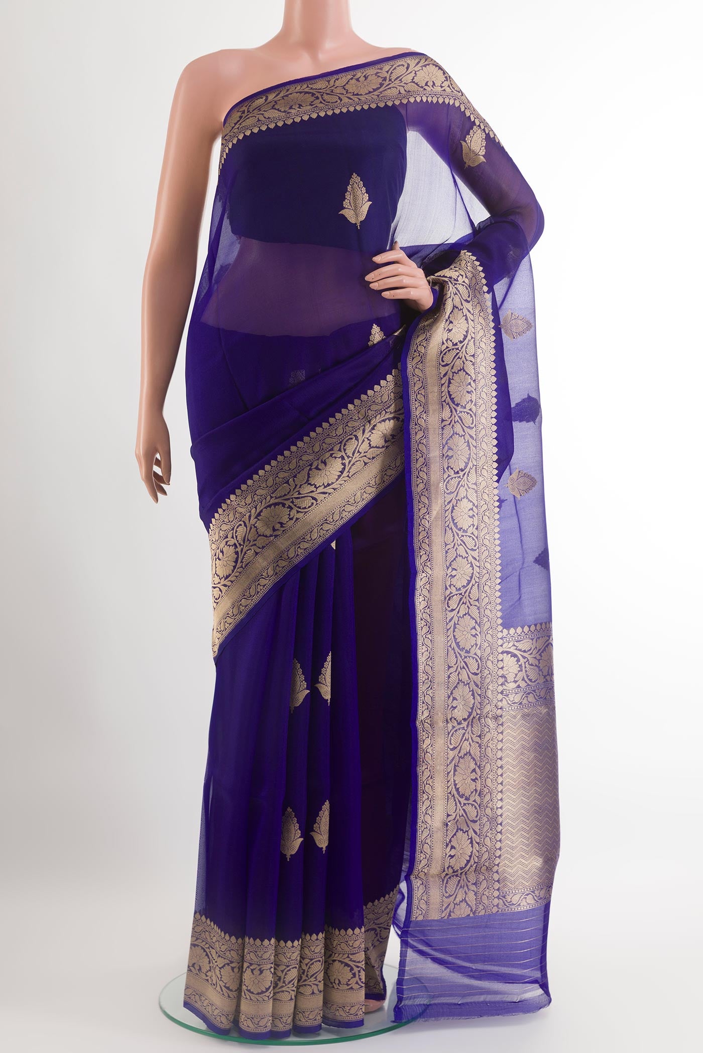 Blue Organza Silk Saree with Zari Butta on the body and Zari Border.  displayed on a mannequin