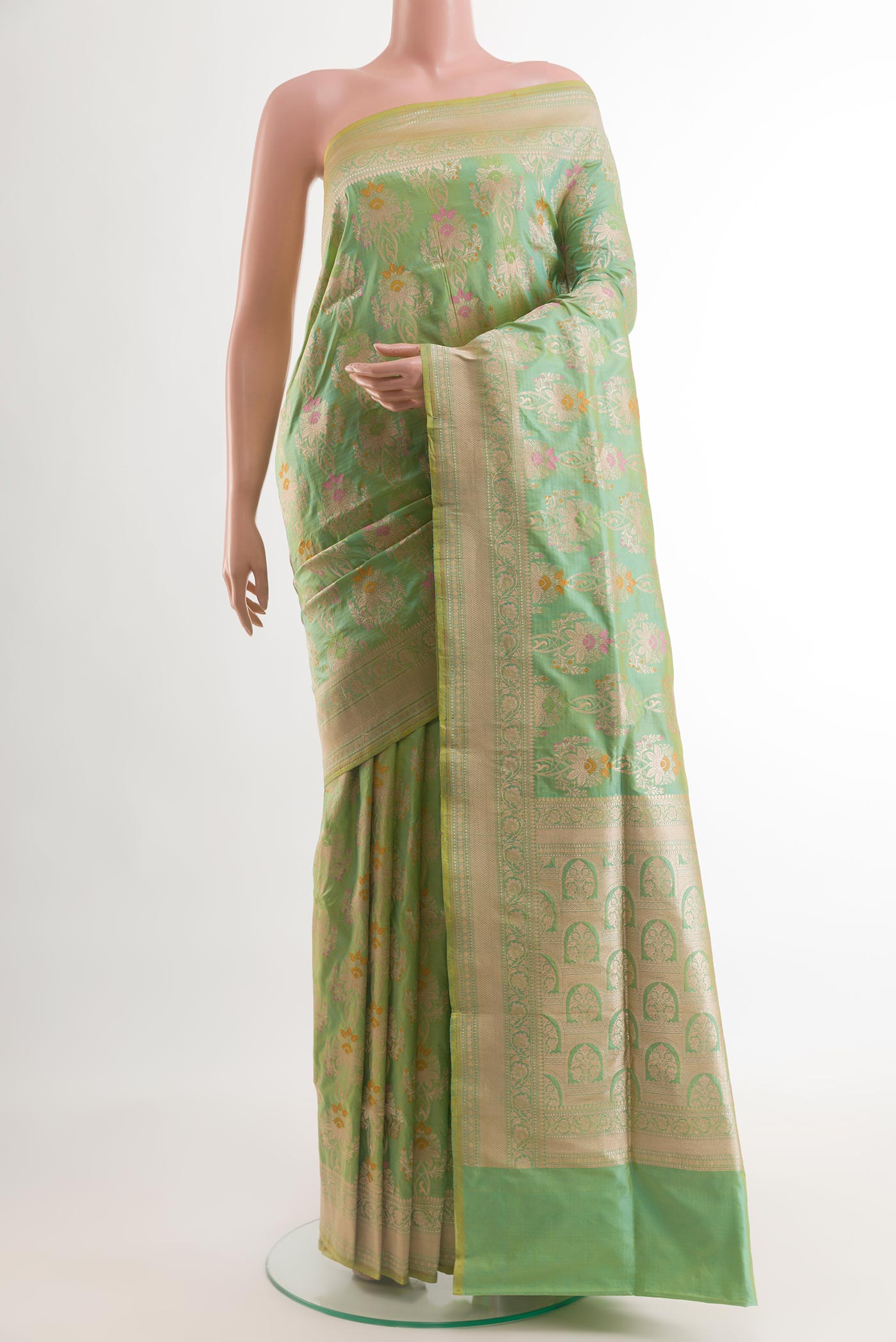 Green Banarasi Silk Saree with Zari Brocade on the body and Zari Border.  displayed on a mannequin