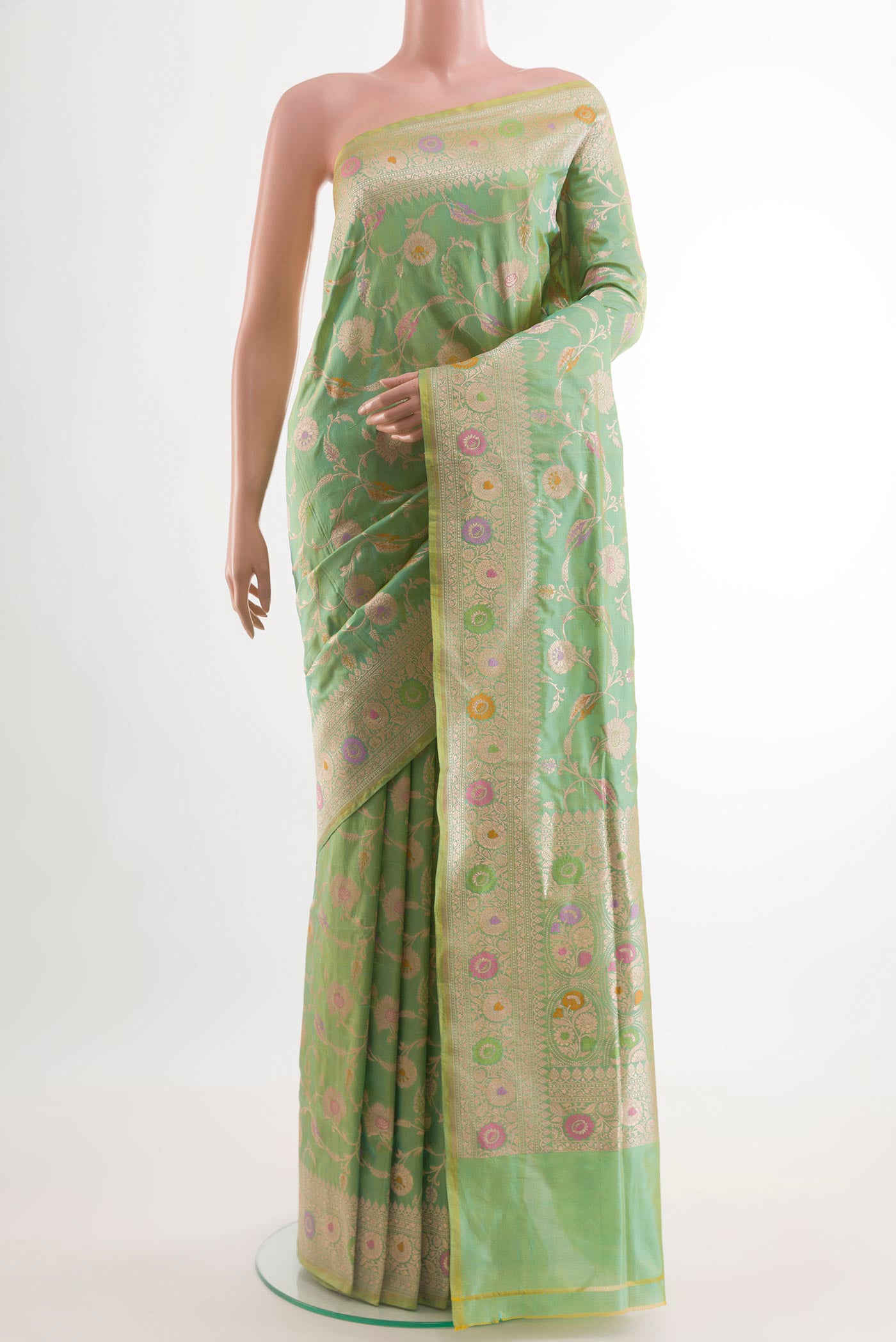 Green Banarasi Silk Saree with Zari Brocade on the body and Zari Border.  displayed on a mannequin