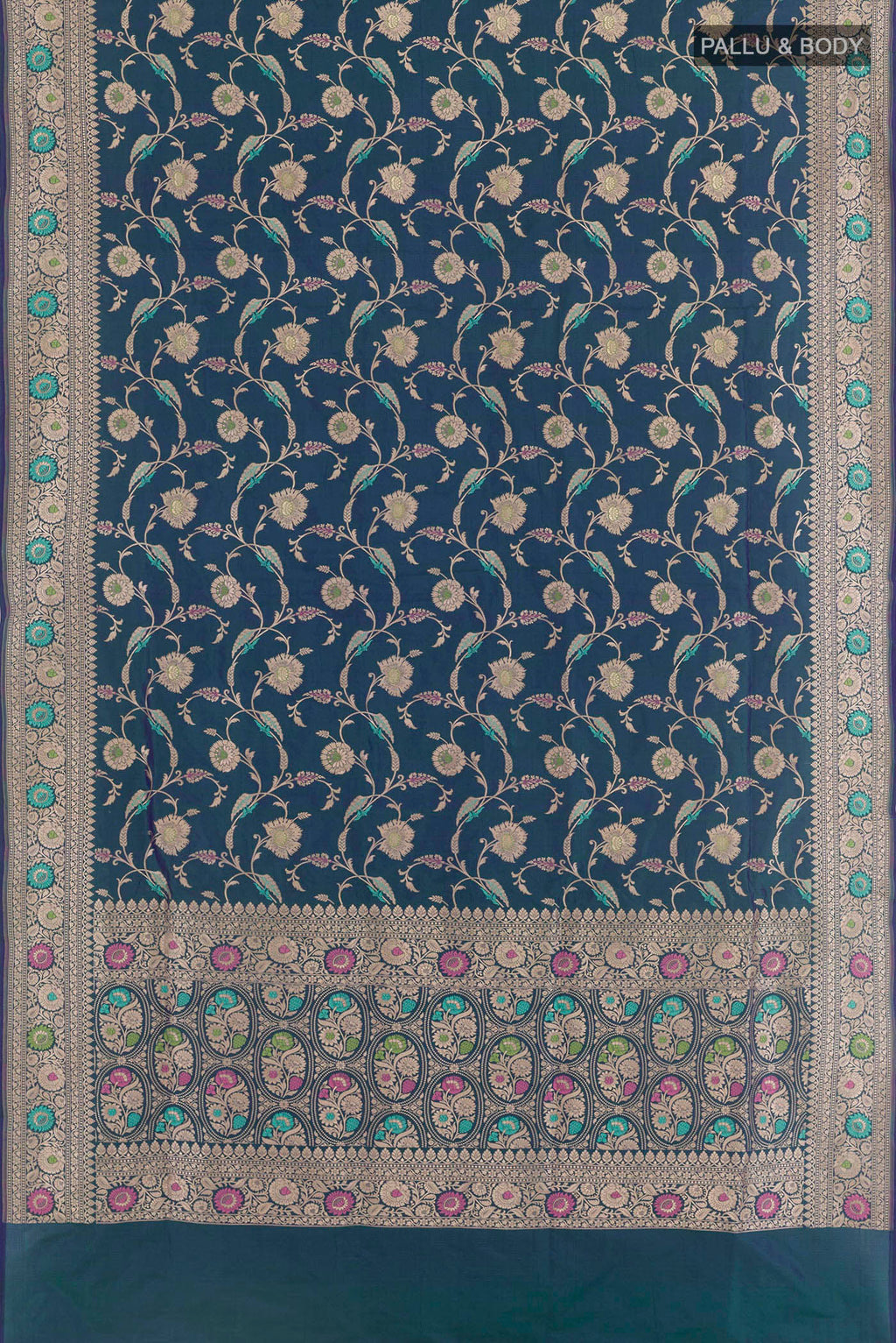 Flat view of Peacock Blue Banarasi Silk Saree with Zari Brocade on the body and Zari Border. 