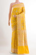 Yellow Banarasi Silk Saree with Zari Brocade on the body and Zari Border.  displayed on a mannequin