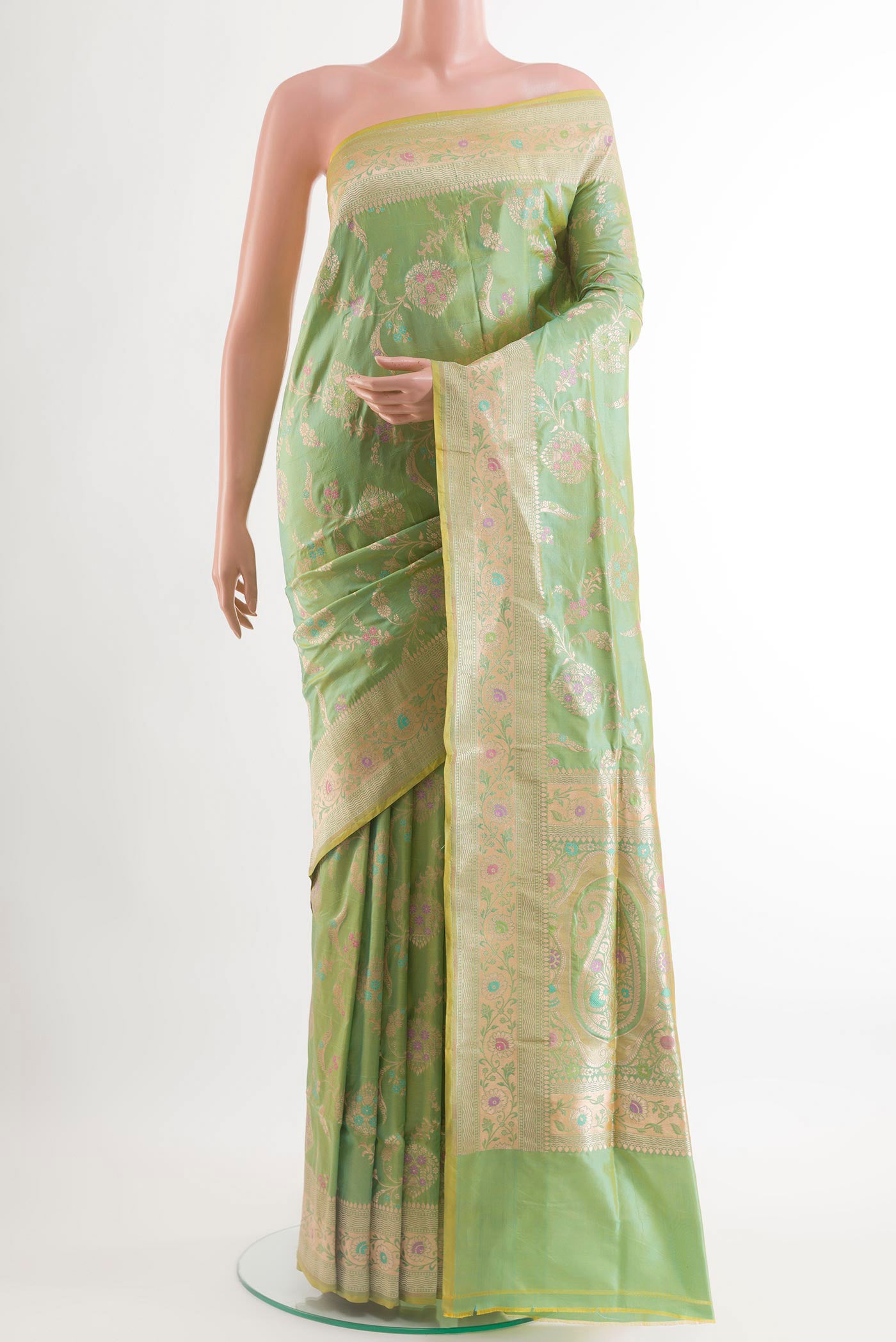 Light Green Banarasi Silk Saree with Zari Brocade on the body and Zari Border.  displayed on a mannequin