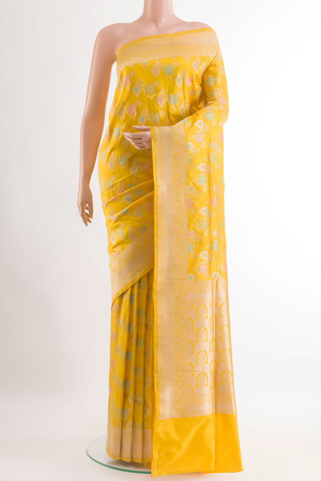 Yellow Banarasi Silk Saree with Zari Brocade on the body and Zari Border.  displayed on a mannequin
