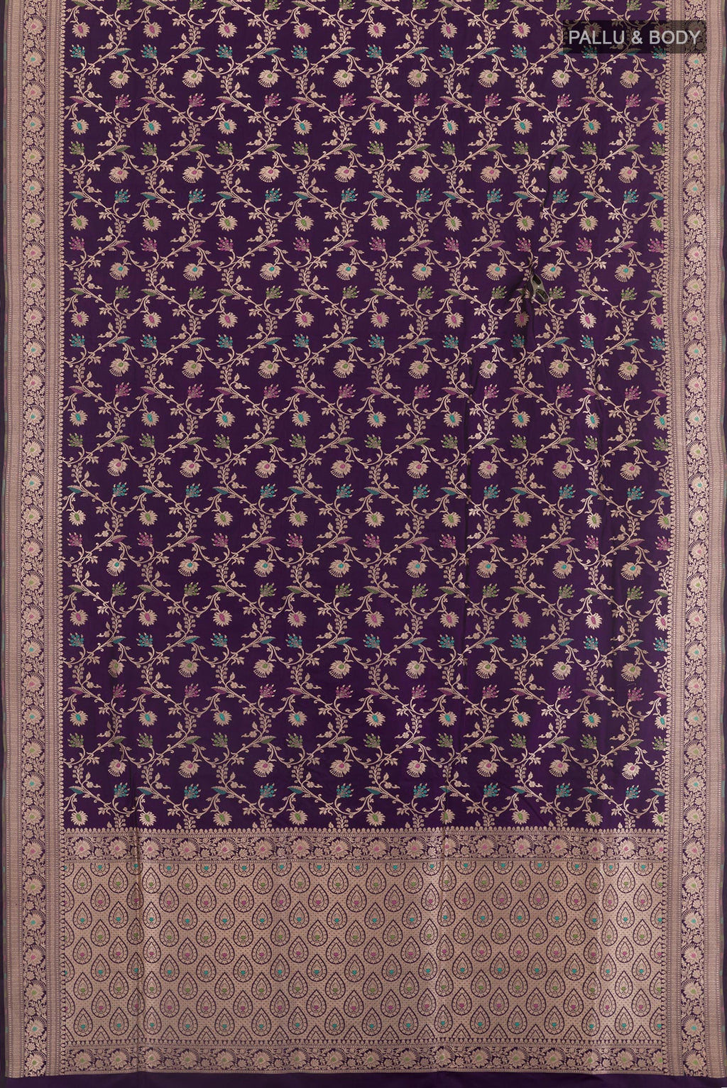 Flat view of Purple Banarasi Silk Saree with Zari Brocade on the body and Zari Border. 