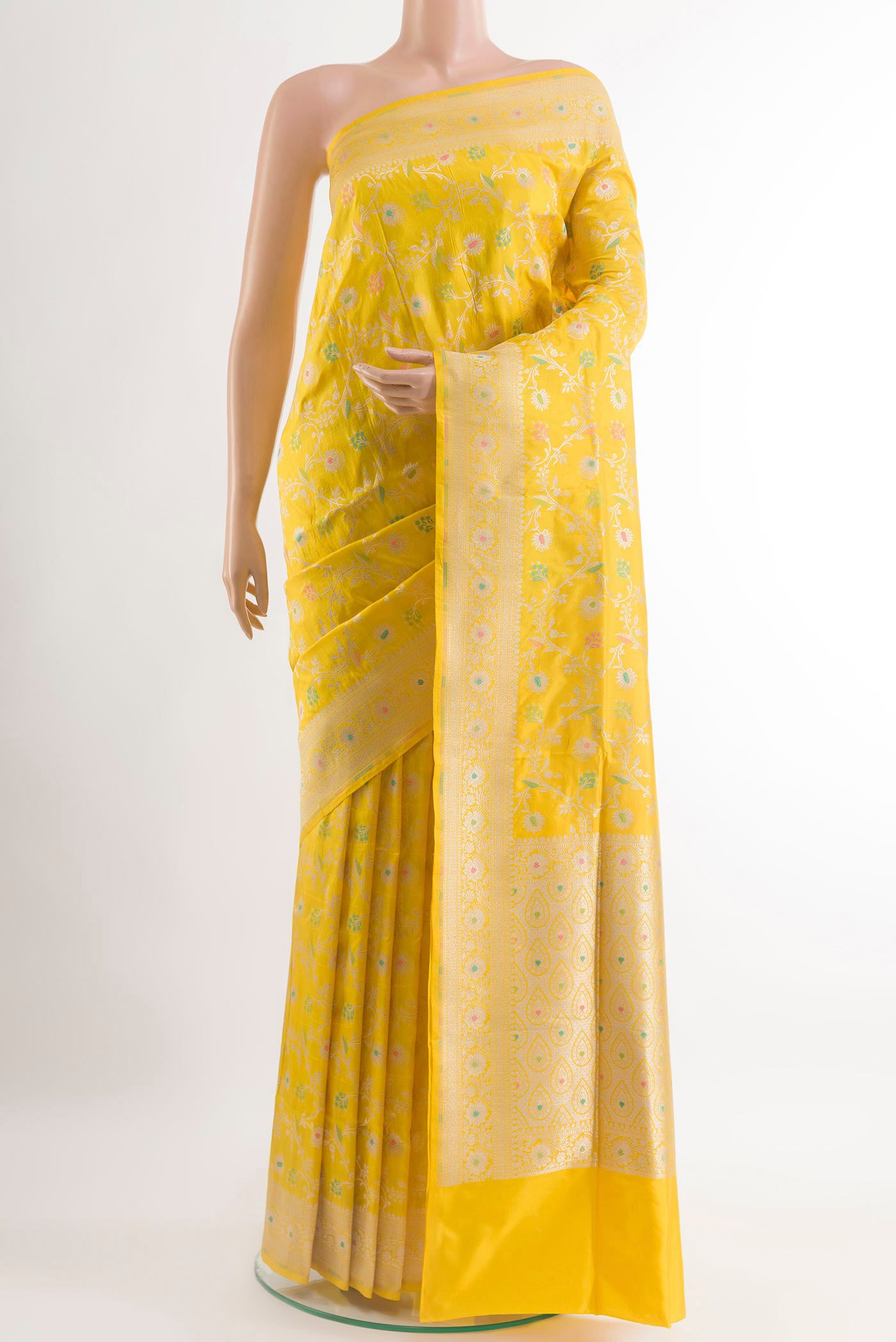 Yellow Banarasi Silk Saree with Zari Brocade on the body and Zari Border.  displayed on a mannequin