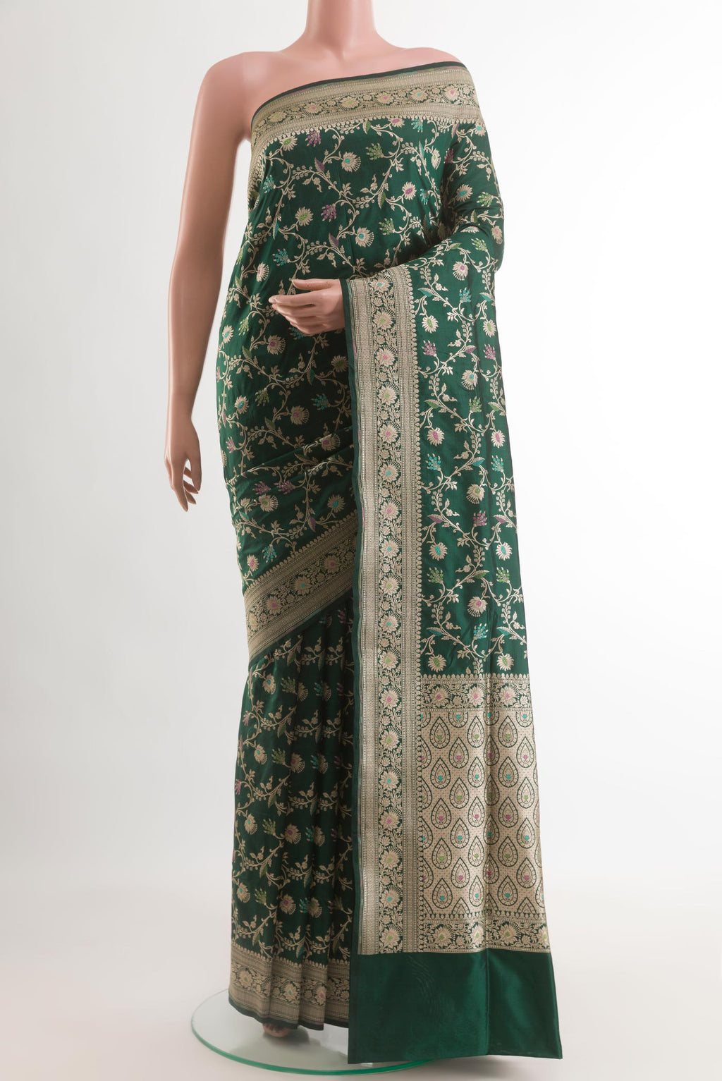 Green Banarasi Silk Saree with Zari Brocade on the body and Zari Border.  displayed on a mannequin
