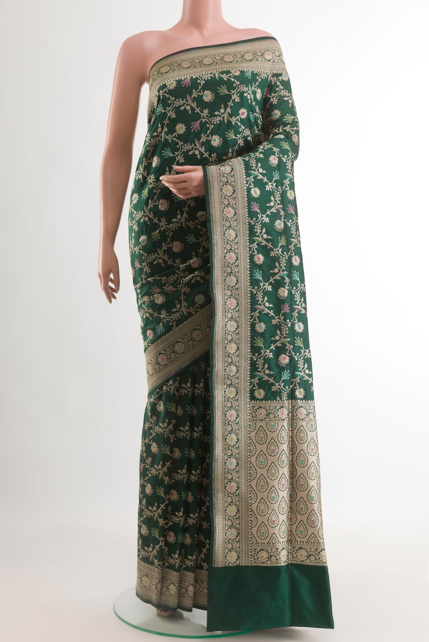 Green Banarasi Silk Saree with Zari Brocade on the body and Zari Border.  displayed on a mannequin