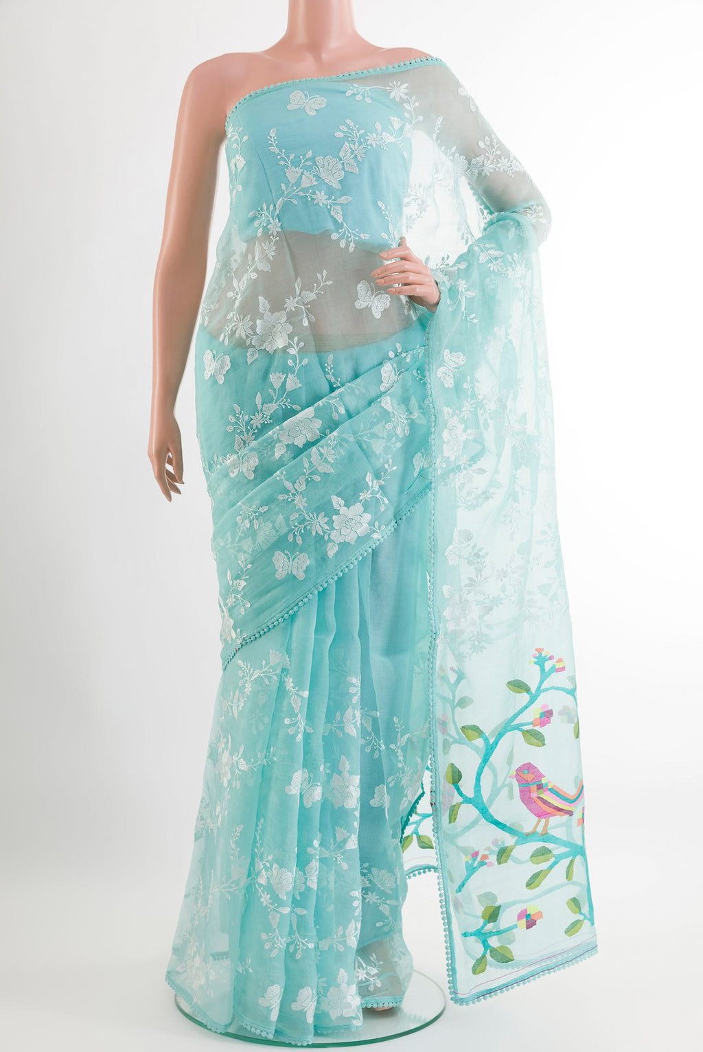 Blue Organza Silk Saree with Embroidery on the body and Embroidery Border.  displayed on a mannequin