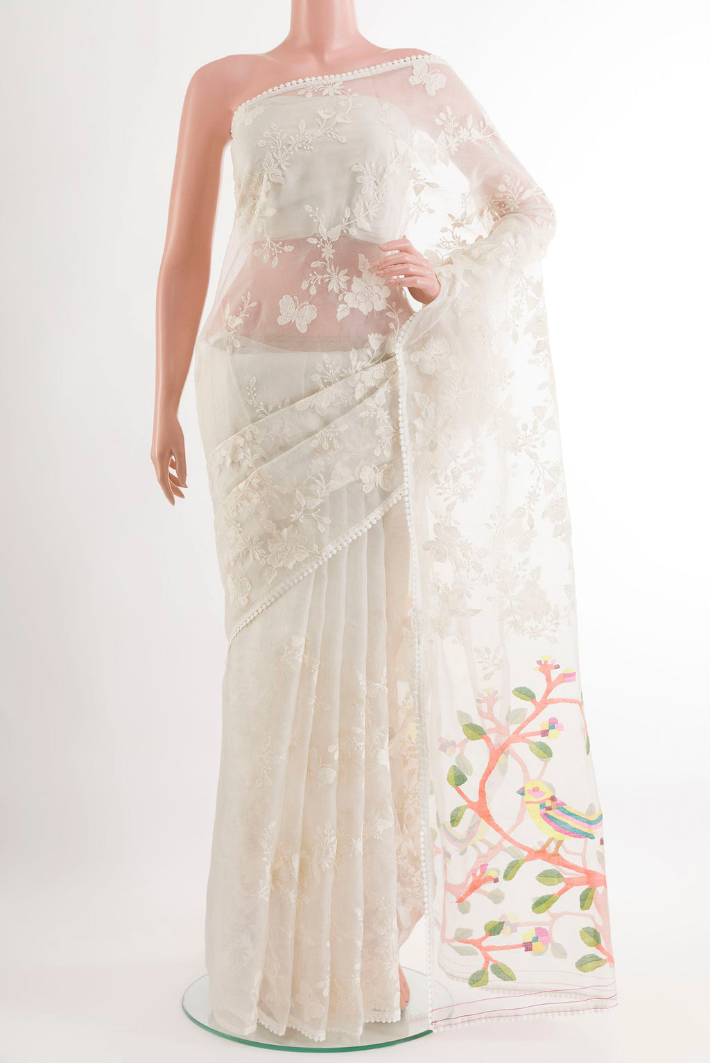 Off White Organza Silk Saree with Embroidery on the body and Embroidery Border.  displayed on a mannequin