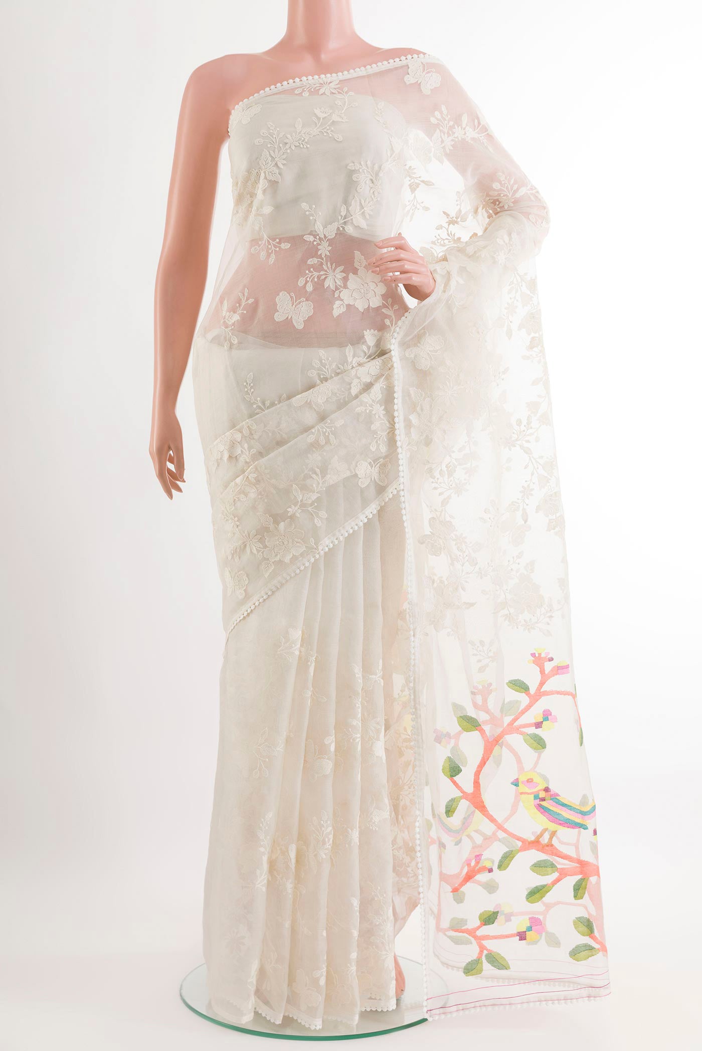 Off White Organza Silk Saree with Embroidery on the body and Embroidery Border.  displayed on a mannequin