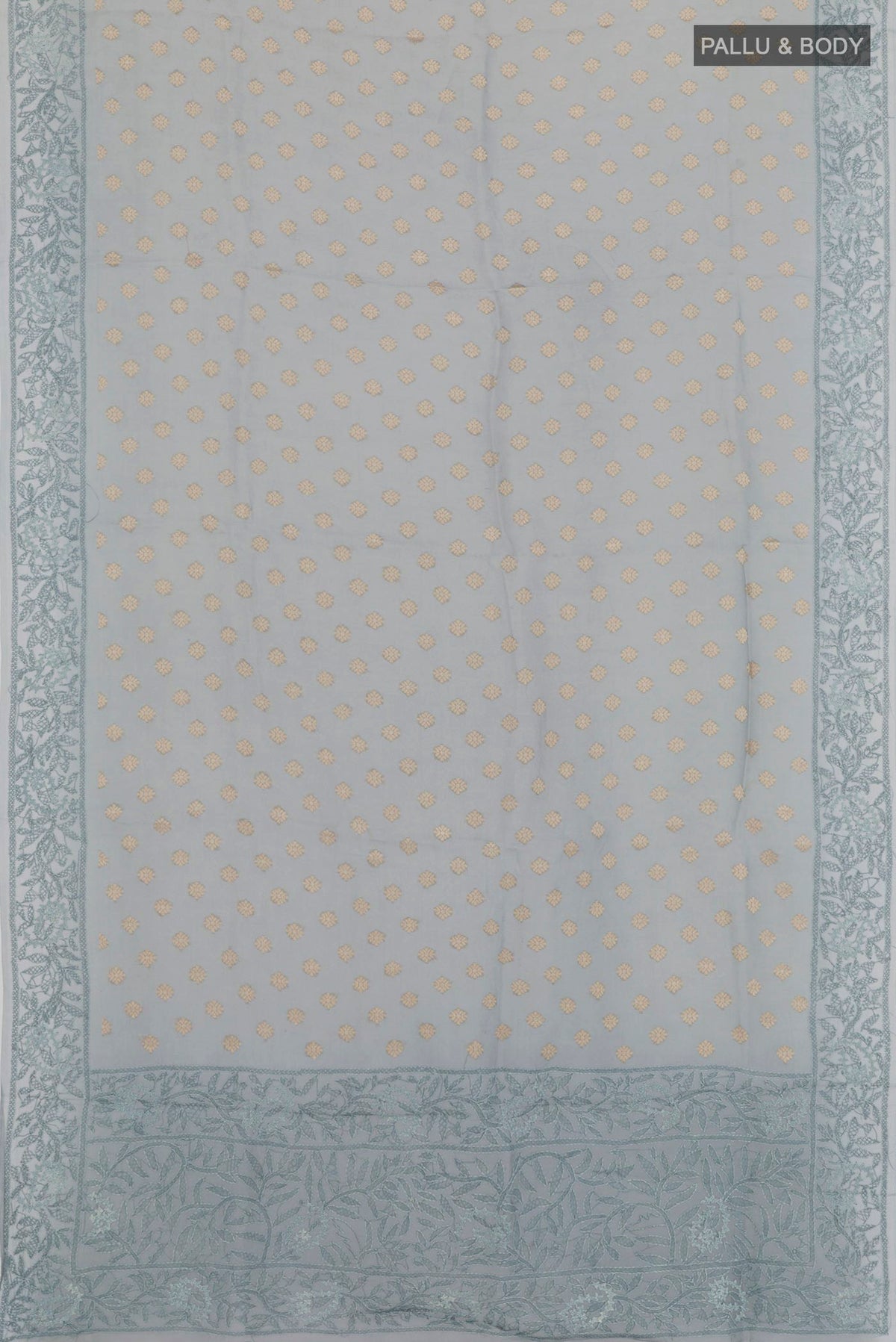 Flat view of Grey Organza Silk Saree with Zari Butta on the body and Embroidery Border. 