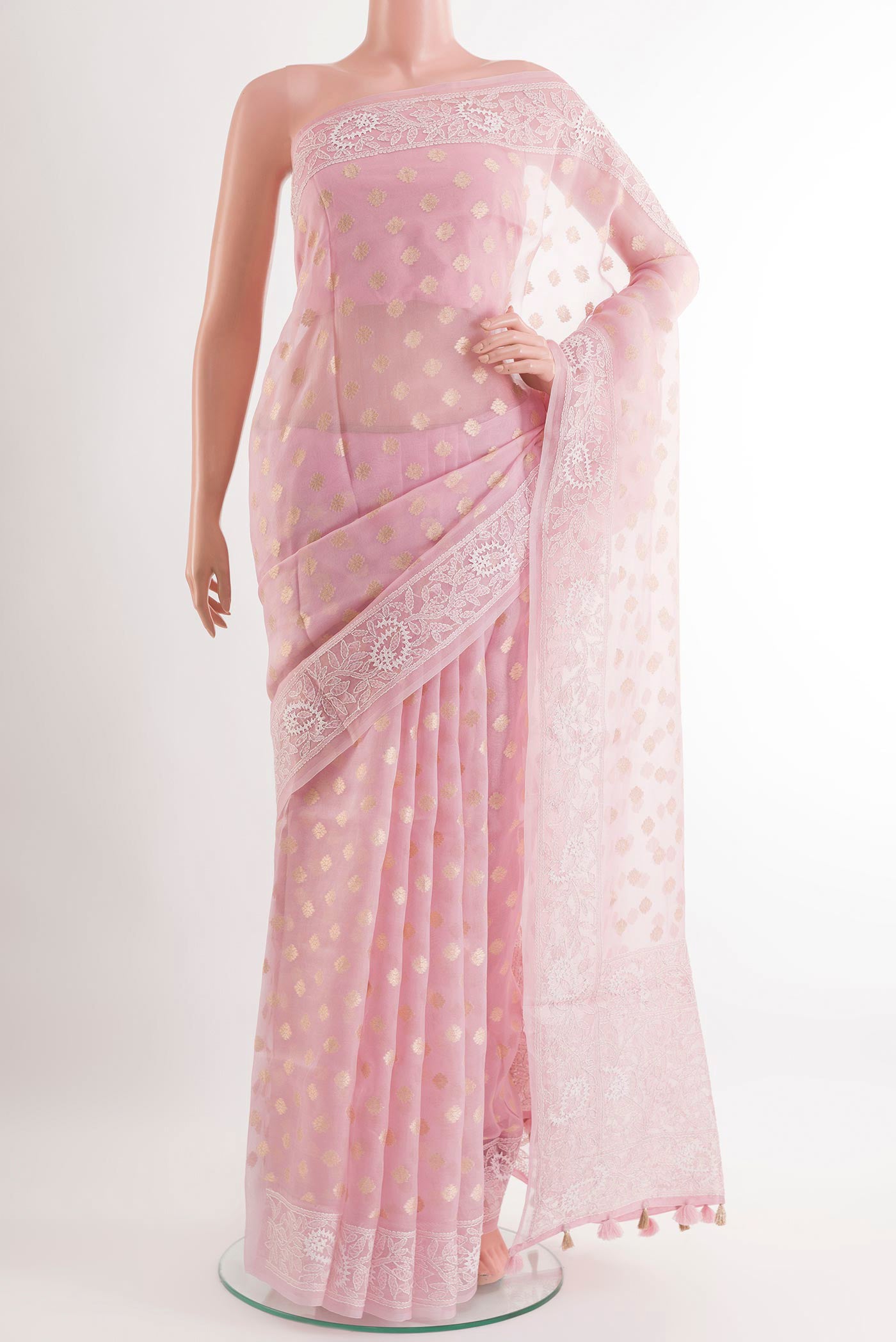 Pink Organza Silk Saree with Zari Butta on the body and Embroidery Border.  displayed on a mannequin