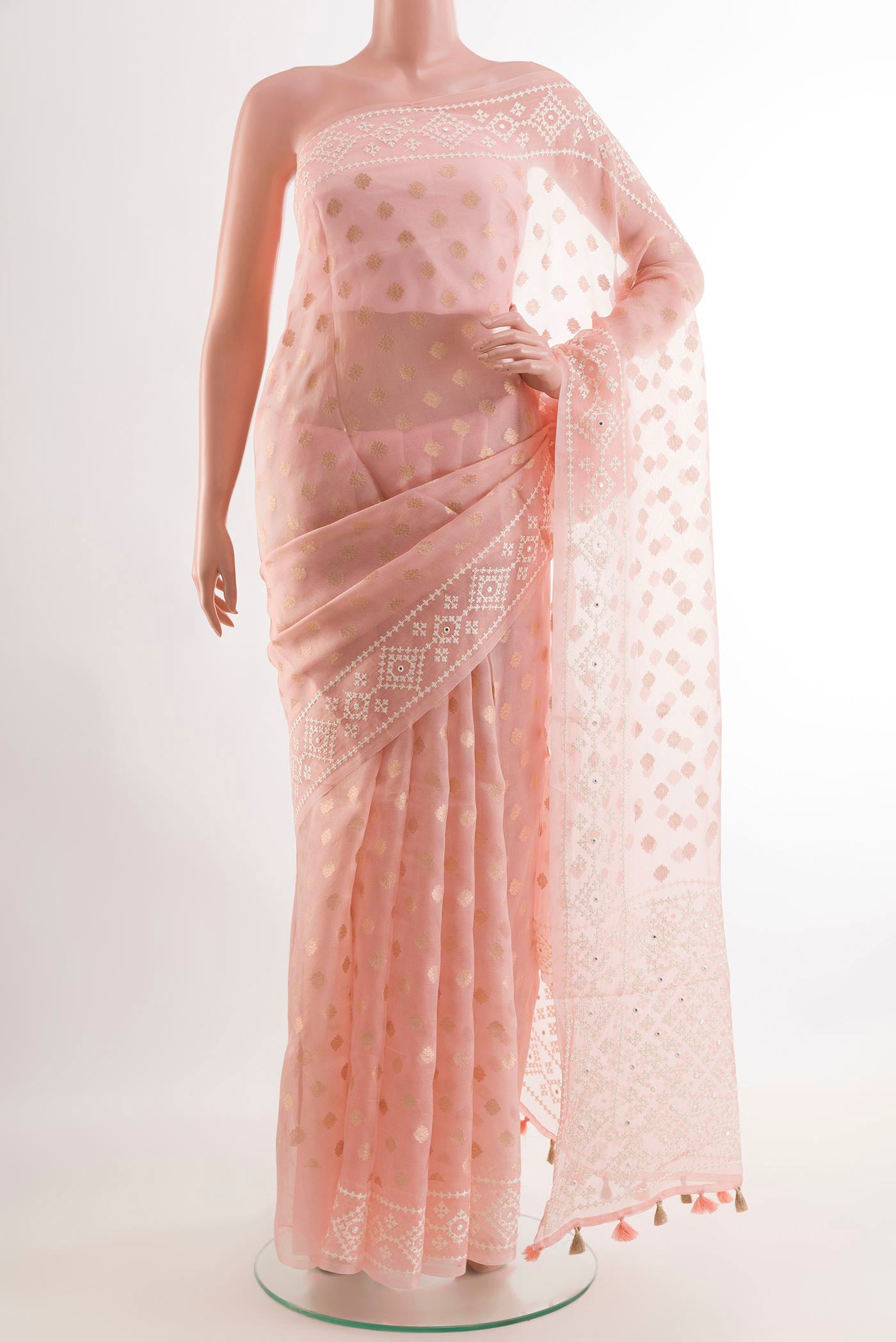 Pink Organza Silk Saree with Zari Butta on the body and Embroidery Border.  displayed on a mannequin