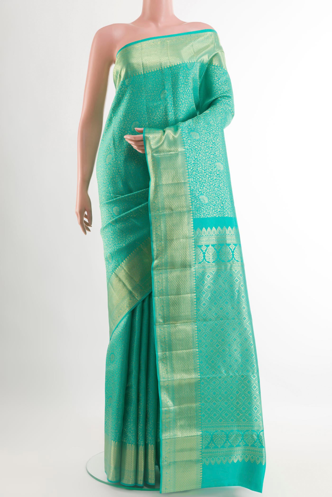 Sea Green Kanchipuram Silk Saree with Zari Brocade on the body and Zari Border.  displayed on a mannequin