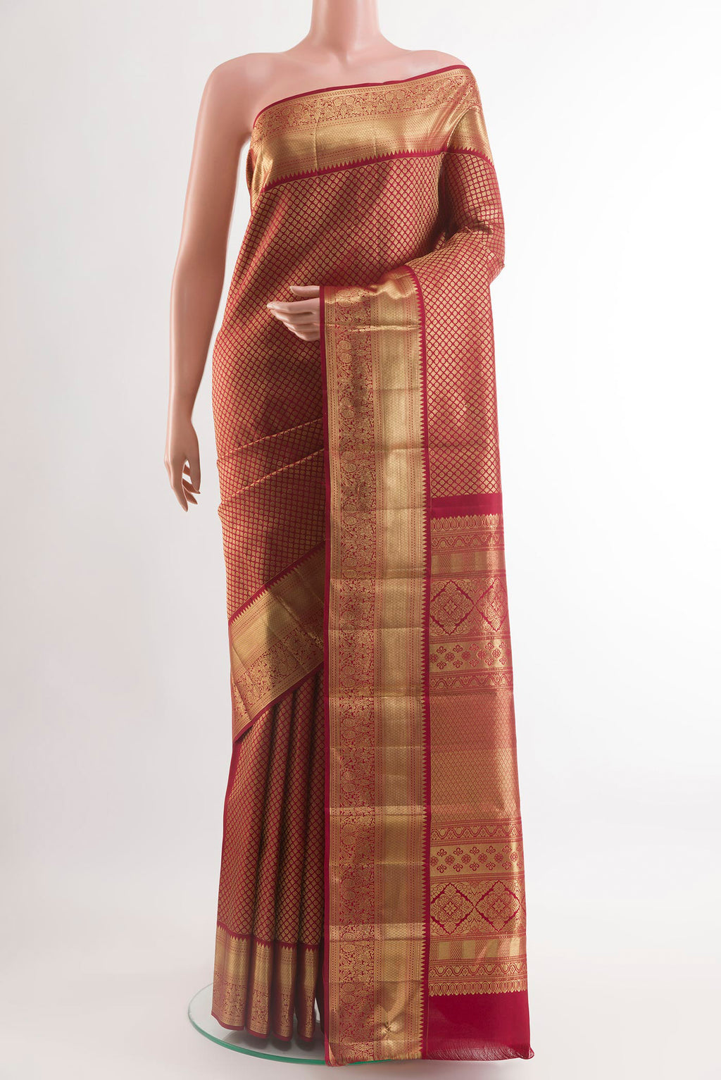 Brown Kanchipuram Silk Saree with Zari Brocade on the body and Zari Border.  displayed on a mannequin