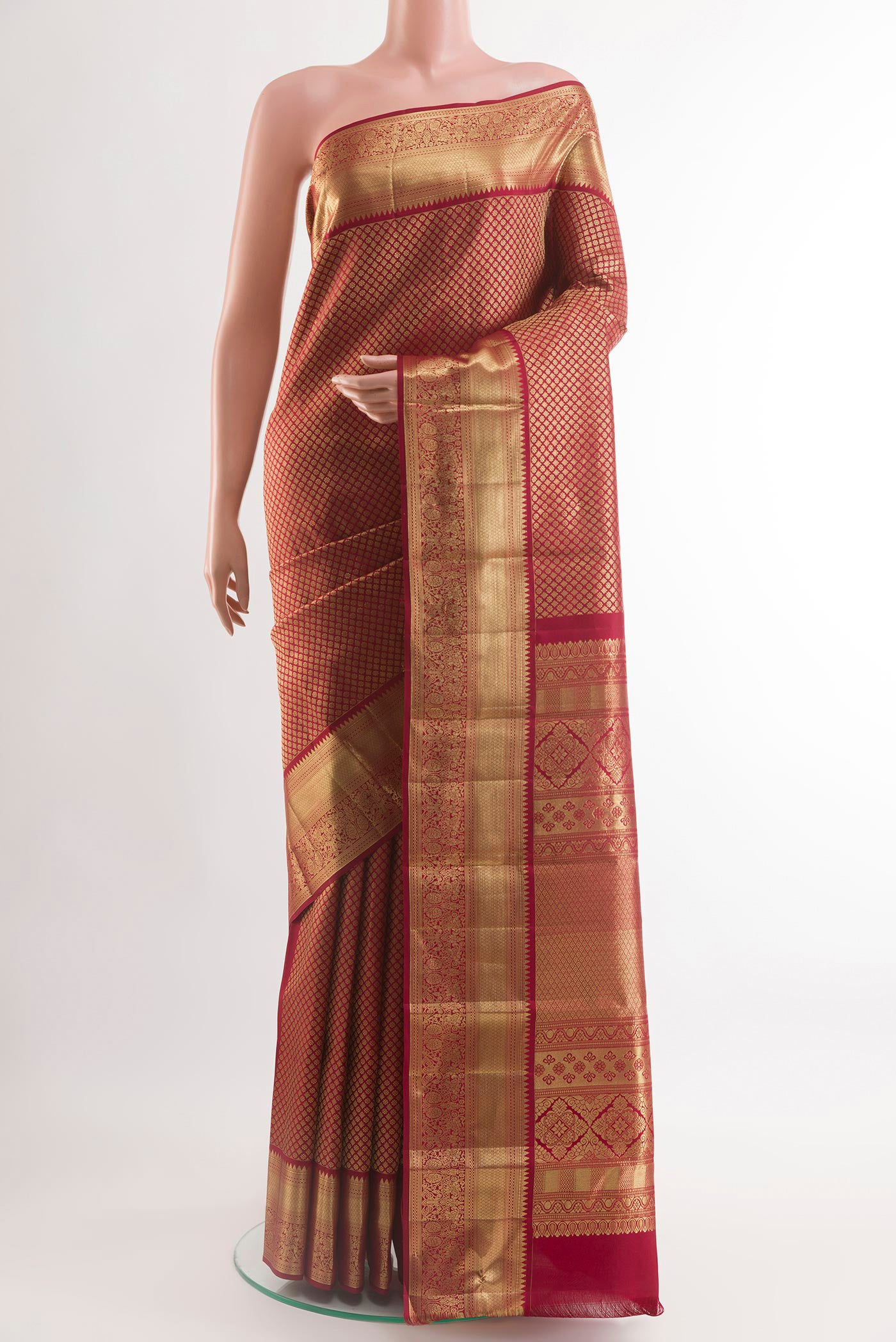 Brown Kanchipuram Silk Saree with Zari Brocade on the body and Zari Border.  displayed on a mannequin