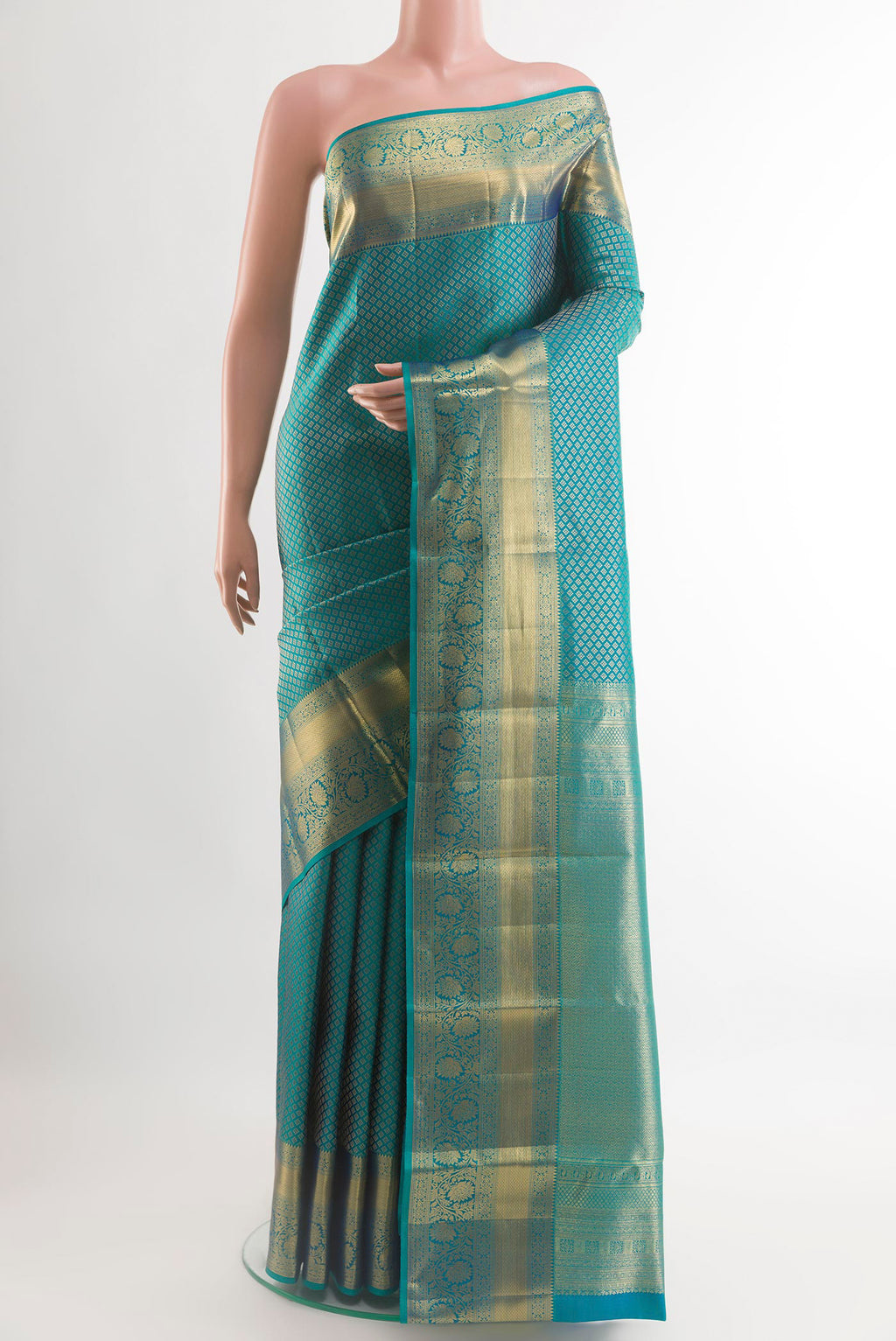 Sea Green Kanchipuram Silk Saree with Zari Brocade on the body and Zari Border.  displayed on a mannequin