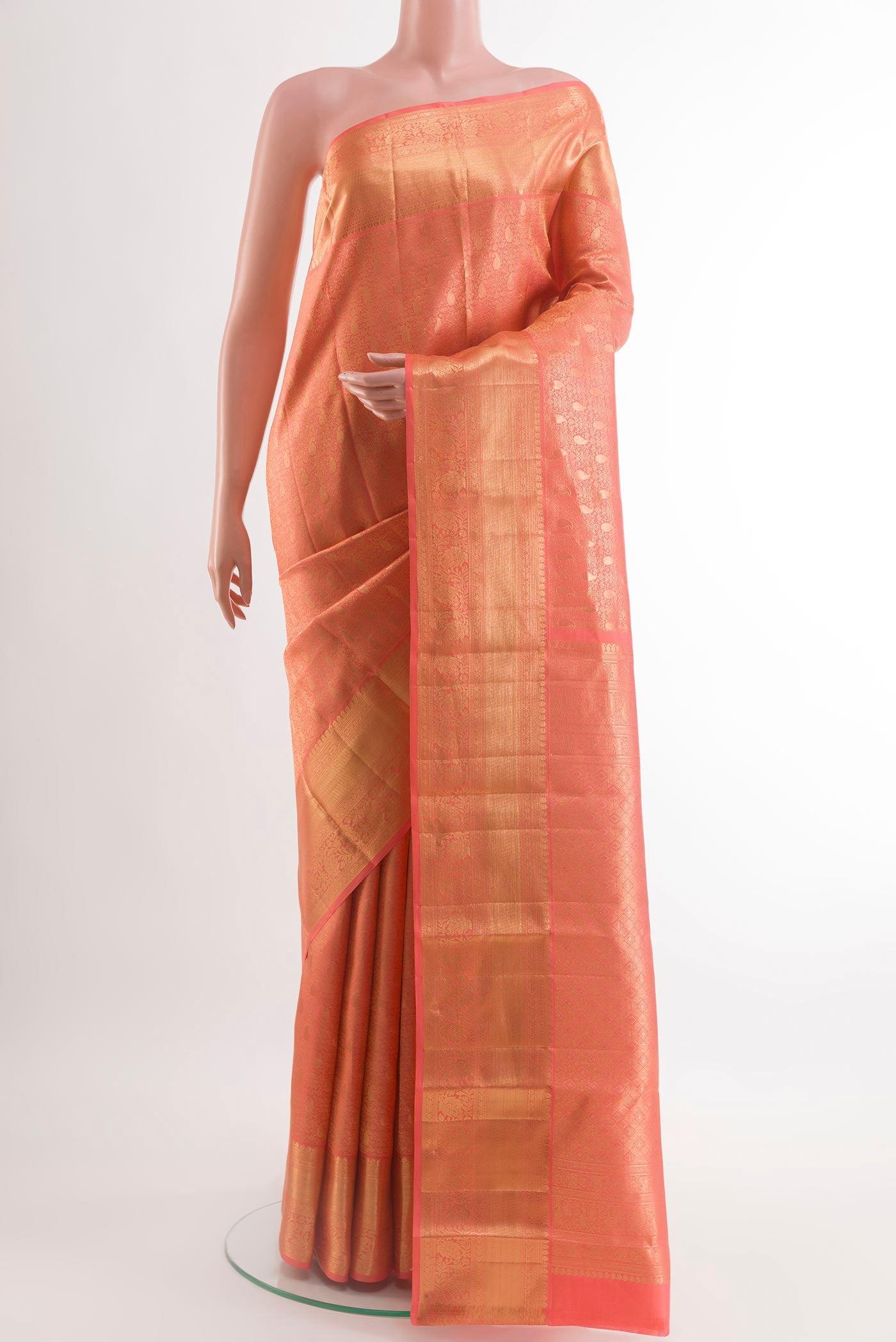 Rose pink Kanchipuram Silk Saree with Zari Brocade on the body and Zari Border.  displayed on a mannequin