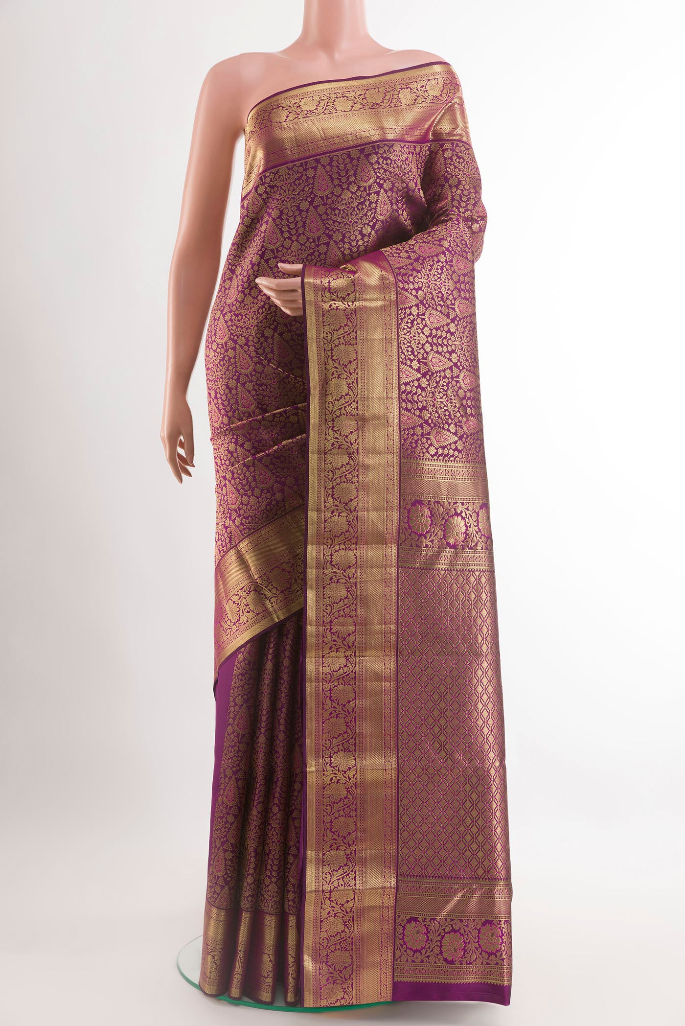 Purple Kanchipuram Silk Saree with Zari Brocade on the body and Zari Border.  displayed on a mannequin