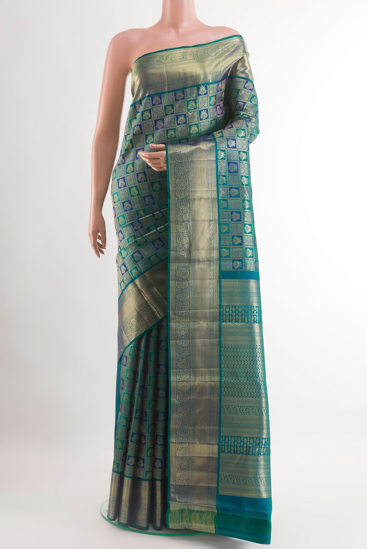 Sea Green Kanchipuram Silk Saree with Zari Brocade on the body and Zari Border.  displayed on a mannequin