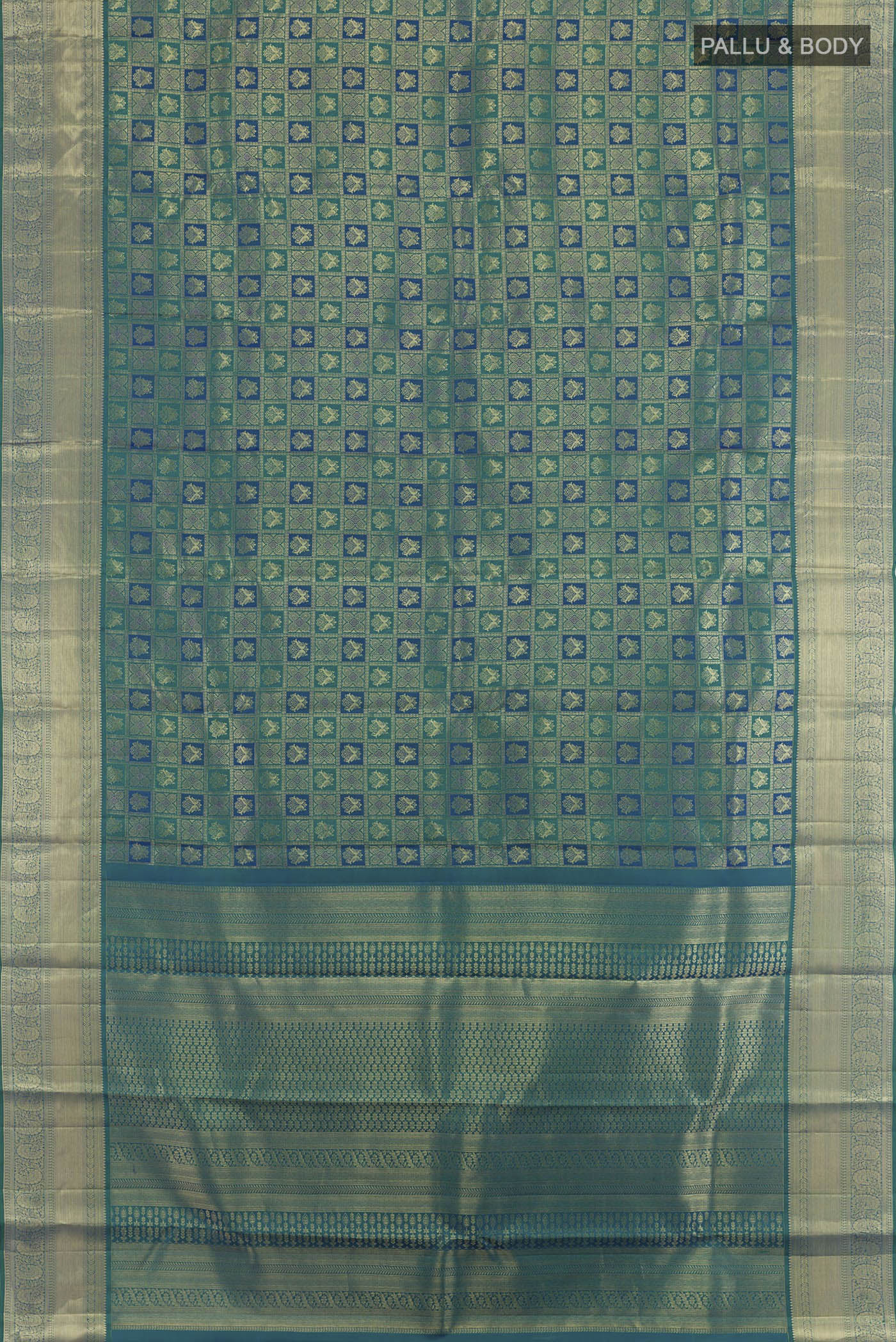 Flat view of Sea Green Kanchipuram Silk Saree with Zari Brocade on the body and Zari Border. 